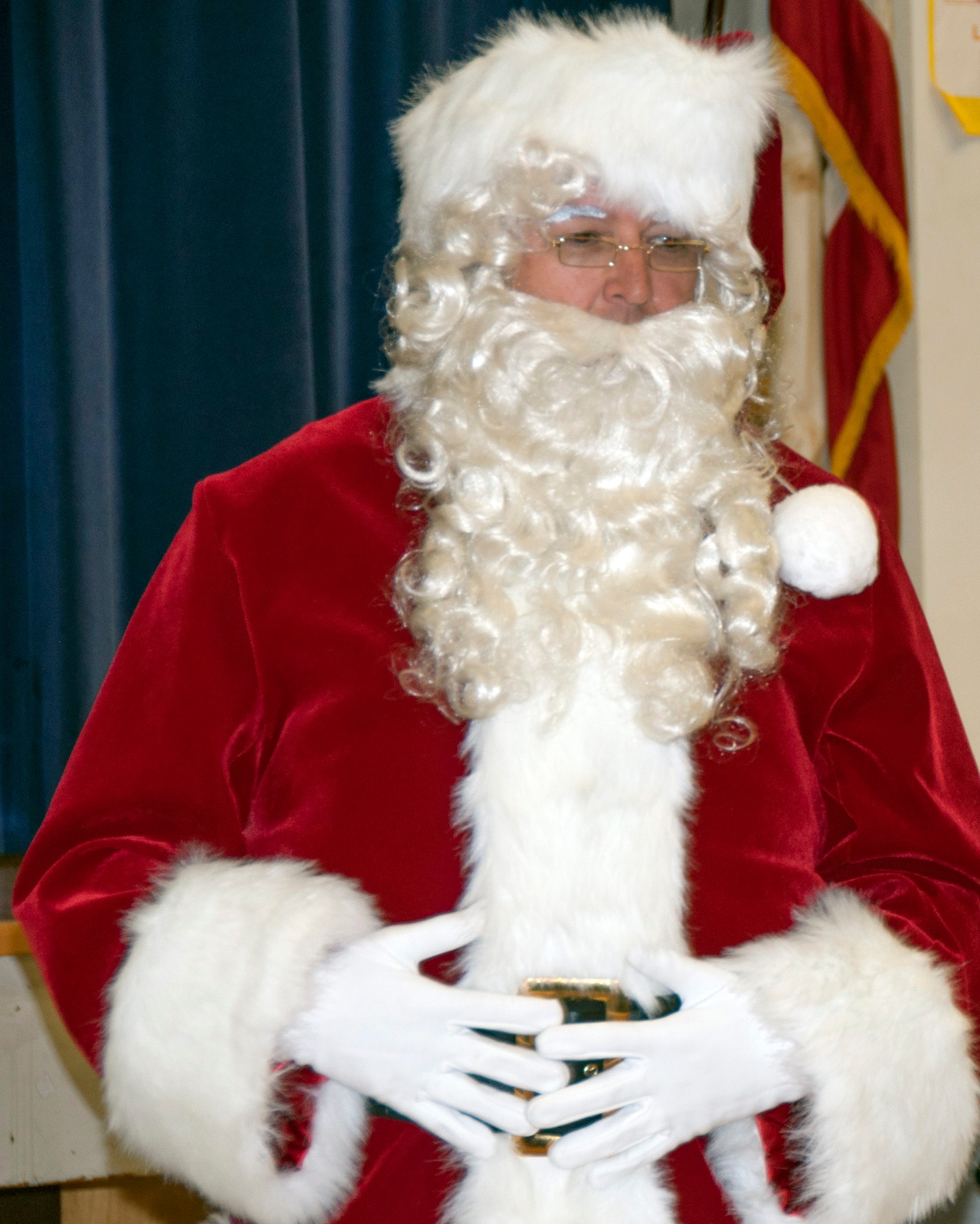 TRAVIS AIR FORCE BASE, Calif. -- For nearly three decades, members of Team Travis have been participating in Operation Teddy Bear. This year, the 349th Medical Group hosted the event and had more than 25 volunteers. Airmen visited local Solano County kindergarten children and distributed 480 gift bags filled with Teddy bears, candy canes, juice boxes, toys, and pencils. The children also got an unexpected surprise; a visit from Santa himself. Chief Master Sgt. Louis Kloeppel, or as he's known to the children, "Santa," listened as each child whispered their Christmas gift wishes in his ear. (U.S. Air Force photo/Staff Sgt. Amelia Leonard)