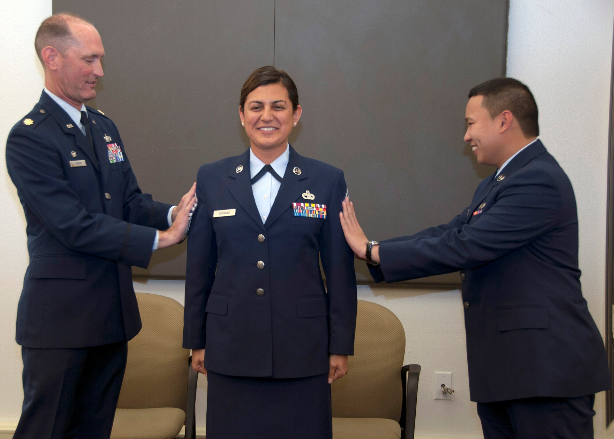 TRAVIS AIR FORCE BASE, Calif. -- Chief Master Sergeant Teresa Serrano, 45th Aerial Port Squadron, pins on the rank of Chief during a pinning-on ceremony held here at Travis Air Force Base, Calif. on Dec. 7, 2013. (U.S. Air Force photo/Staff Sgt. Amelia Leonard)
   