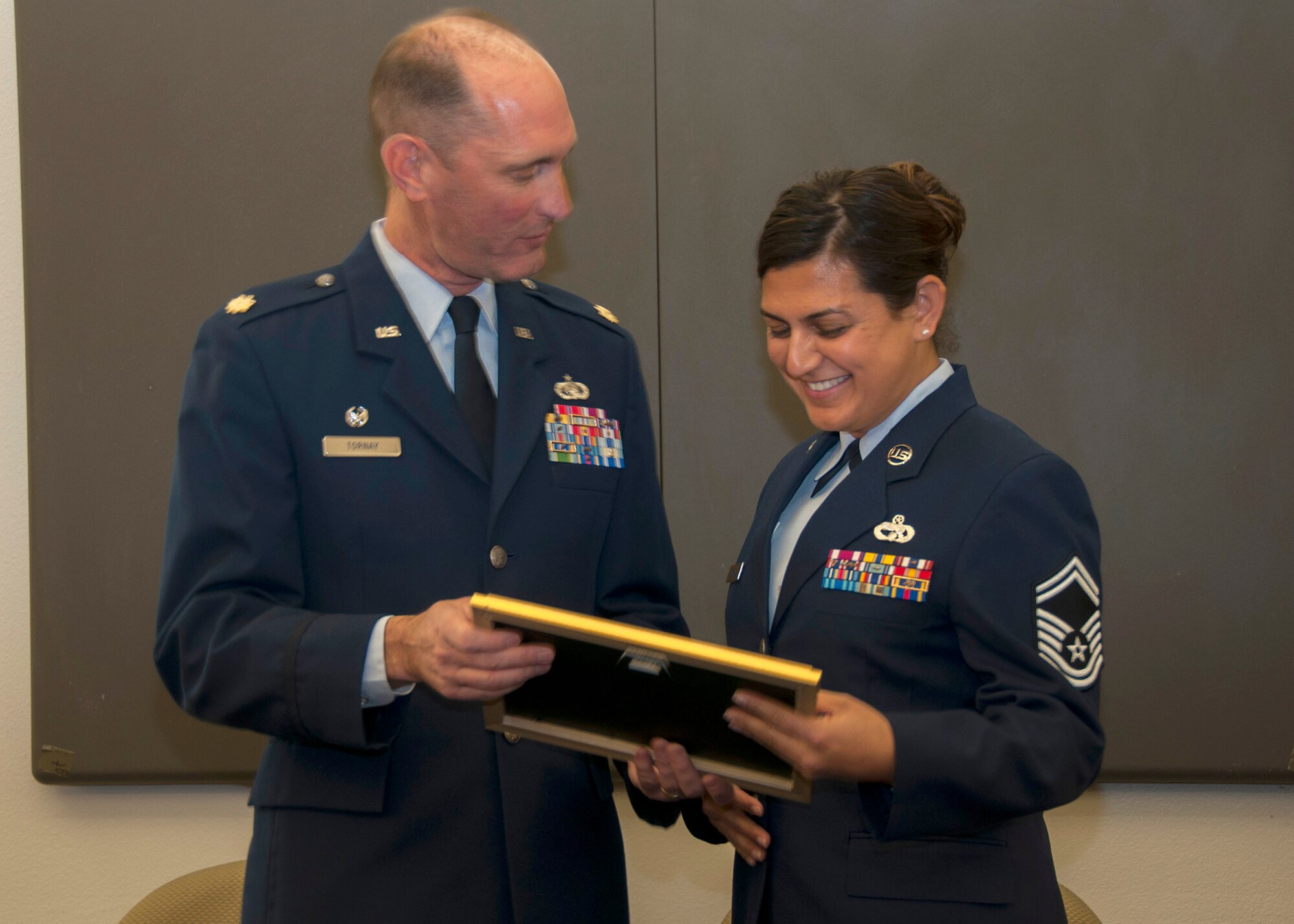 TRAVIS AIR FORCE BASE, Calif. -- Chief Master Sergeant Teresa Serrano, 45th Aerial Port Squadron, pins on the rank of Chief during a pinning-on ceremony held here at Travis Air Force Base, Calif. on Dec. 7, 2013. (U.S. Air Force photo/Staff Sgt. Amelia Leonard)
   
