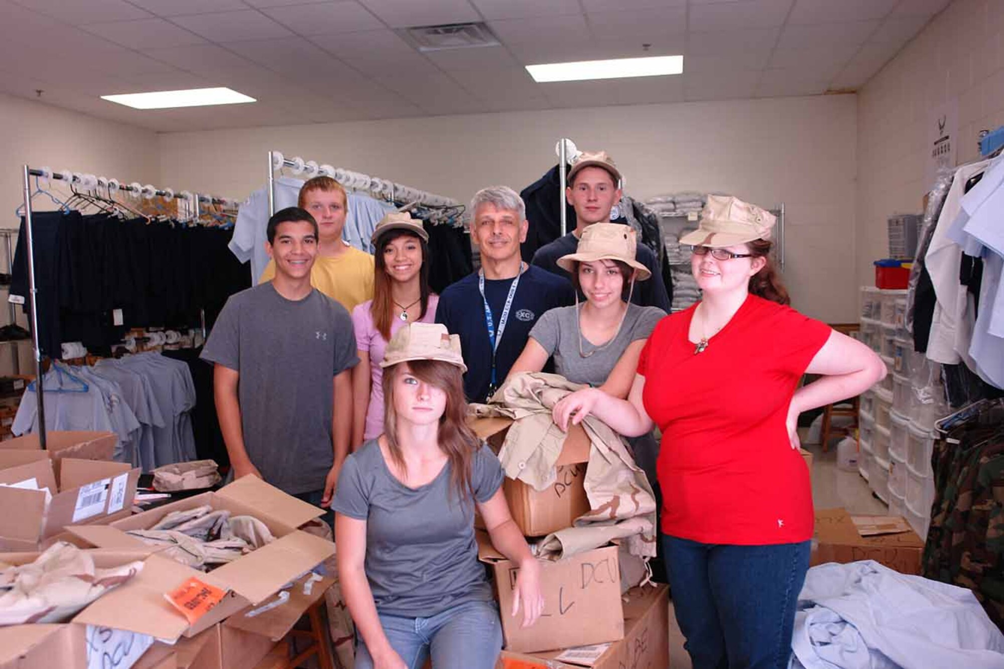 The members and instructor of the Franklin County High School (FCHS) National Defense Cadet Corps (NDCC) examine boxes of mobility gear donated by the AEDC Logistics Office. Pictured in the front row (l-r) is Tianna Morga, Kylie Brock and Victoria Bolin; middle row (l-r) Nathan Vaughan, Michael Cortazzo and retired Chief Master Sgt. Everett Smith; back row (l-r) Miachael Ridner and Jeremiah Lewis. (Photo by Brian Carter)
