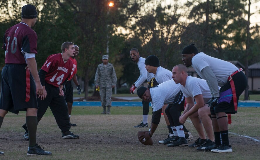 The 23d Logistics Readiness Squadron flag football team prepares to snap the ball during a championship game at Moody Air Force Base, Ga., Dec. 17, 2013.The 23d LRS was up 14-6 at halftime but ended up being defeated by the 23d Medical Group 24-21 in double overtime.. (U.S. Air Force photo by Airman Dillian Bamman/Released)