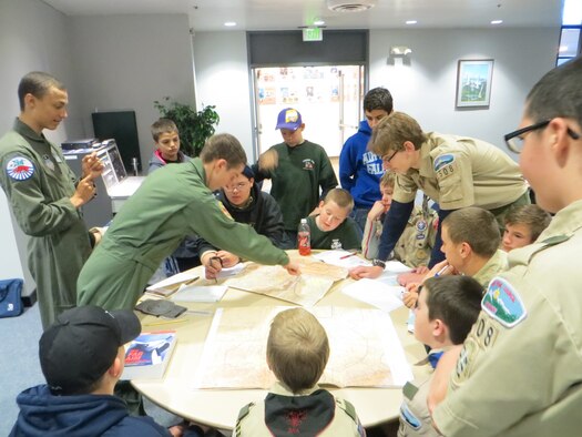 Cadets familiarize Boy Scouts with aviation maps during an aviation workshop at the Air Force Academy Dec. 7.