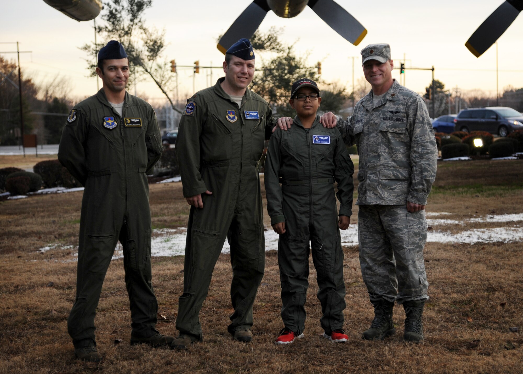 Alejo Resendiz (third from the right), wears his own flight suit Dec. 13, 2013, in front of Little Rock Air Force Base, Ark. A team of Airmen helped Alejo become a pilot for the day through the Make-A-Wish® foundation. (U.S. Air Force photo by Airman 1st Class Harry Brexel)