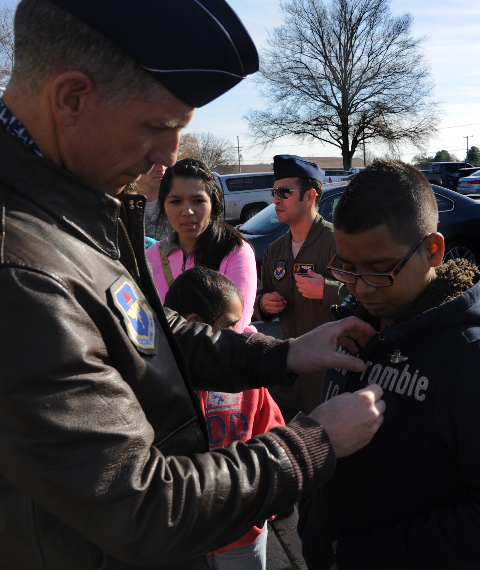 Col. Lee Flint, 314th Operations Group commander, pins on Alejo Resendiz’s wings Dec. 13, 2013, at Little Rock Air Force Base, Ark. Alejo’s wish of becoming “pilot for a day” came true at The Rock through the Make-A-Wish® foundation. (U.S. Air Force photo by Airman 1st Class Harry Brexel)