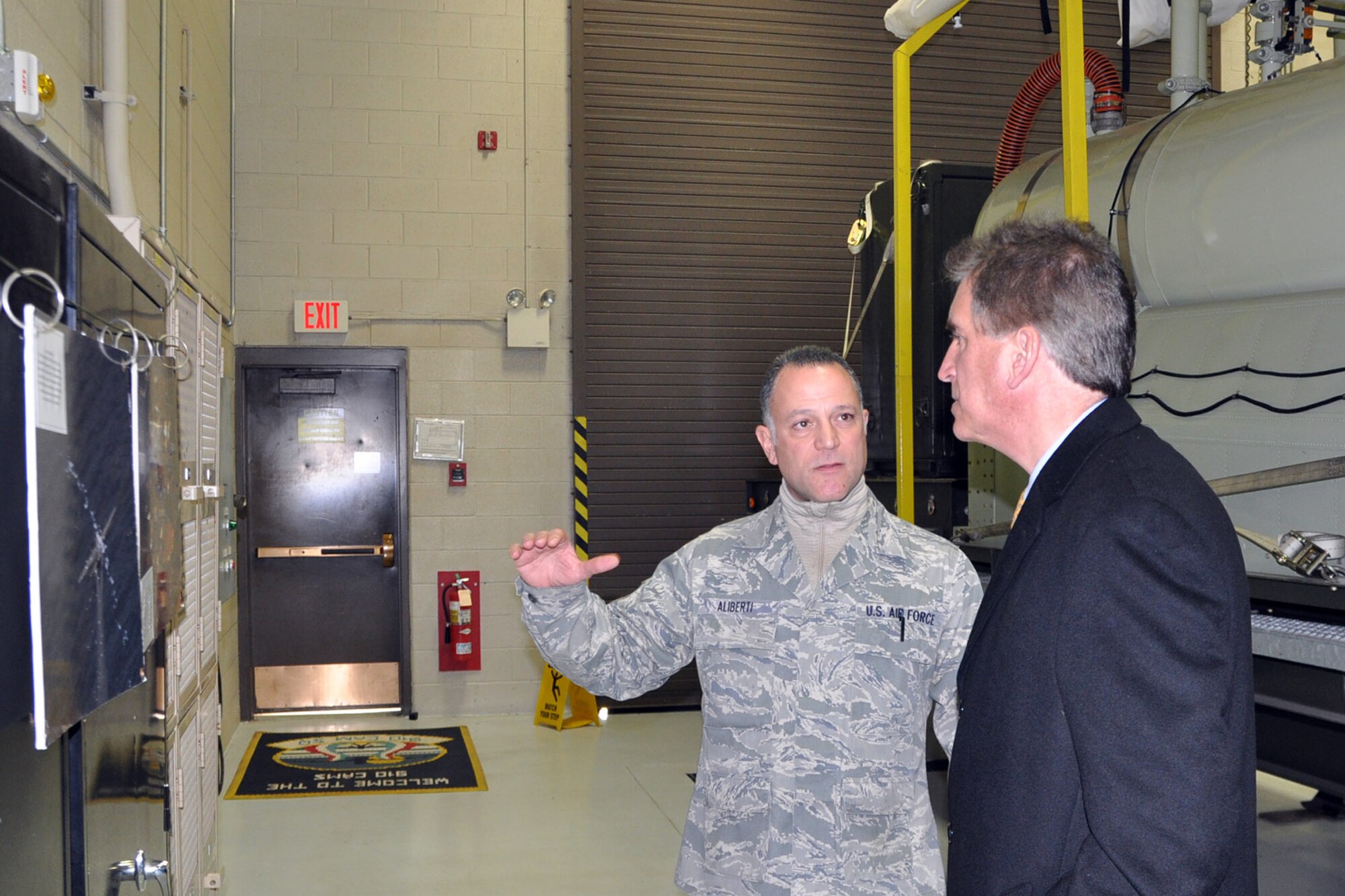 YOUNGSTOWN AIR RESERVE STATION, Ohio – The congressman’s visit to YARS concluded with a guided tour of the wing’s one-of-a-kind mission. Air Force Reserve Senior Master Sgt. Phil Aliberti, 910th Aerial Spray Maintenance Chief, explains the wing’s aerial spray mission during oil spill containment operations in the aftermath of the 2010 sinking of the Deepwater Horizon drilling platform in the Gulf of Mexico to Congressman Jim Renacci, Ohio’s 16th district representative, at the Aerial Spray Facility here during an installation visit, Dec. 19, 2013. Sergeant Aliberti said the unit uses the Modular Aerial Spray Systems (MASS), such as the one sitting on the trailer in the background, to carry out the unit’s unique capability. The 910th Airlift Wing is home to the Department of Defense’s only aerial spray squadron. The congressman visited YARS to learn more about the wing’s mission and the installation’s features firsthand as well as meet some of the Citizen Airmen assigned here. U.S. Air Force photos by Master Sgt. Bob Barko Jr.