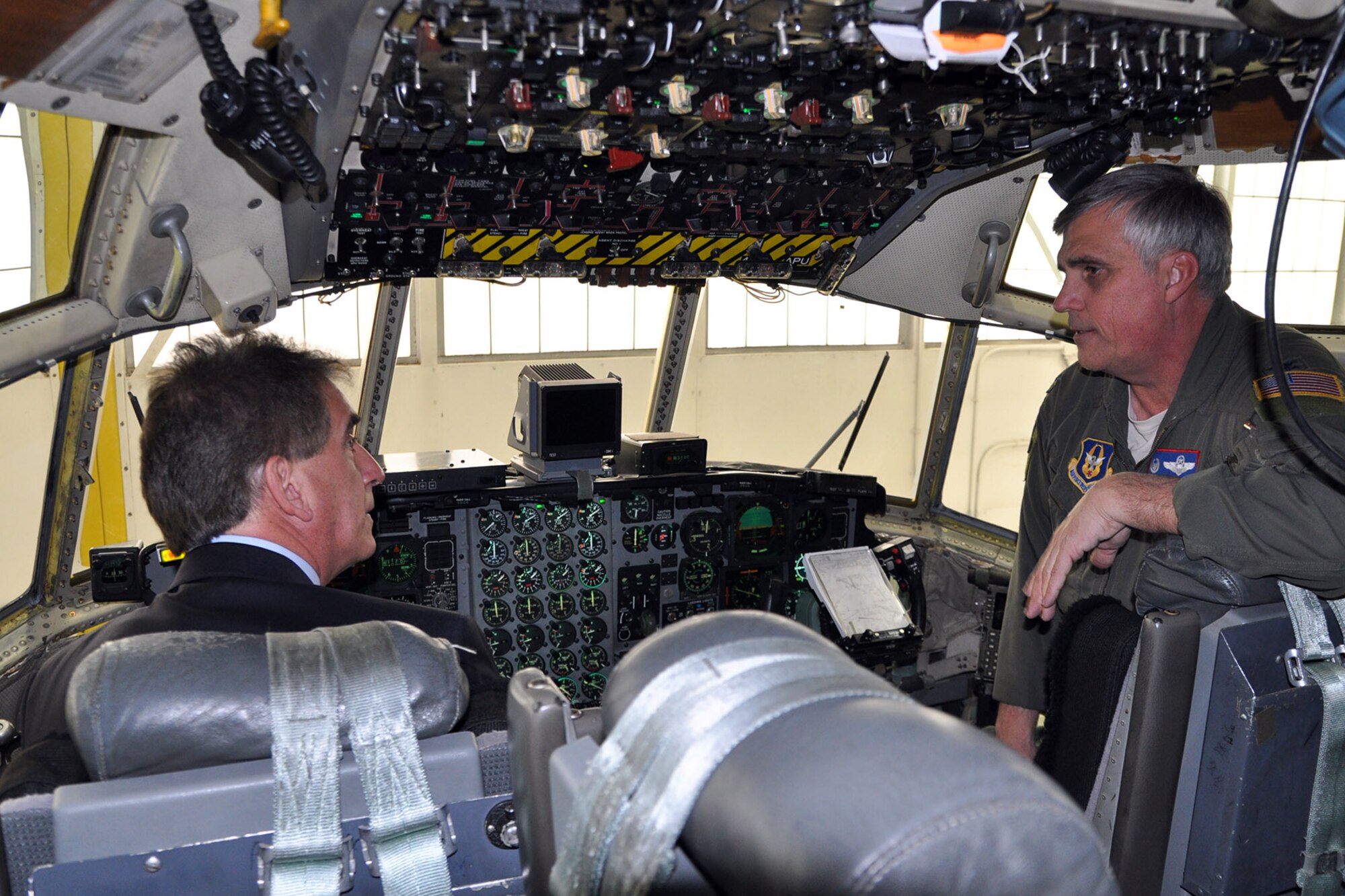 YOUNGSTOWN AIR RESERVE STATION, Ohio – Following a tour of the maintenance hangar, the congressman had the opportunity to get an up close and personal view of one of the wing’s assigned cargo aircraft. Air Force Reserve Col. Bill Phillips (right), commander of the 910th Operations Group, based here, talks with Congressman Jim Renacci (left) of Ohio’s 16th district about aircraft capabilities on the flight deck of a C-130 Hercules cargo aircraft in a hangar here, Dec. 19, 2013. The congressman visited YARS to learn more about the wing’s capabilities and the installation’s features firsthand as well as meet some of the Citizen Airmen assigned here. U.S. Air Force photos by Master Sgt. Bob Barko Jr.