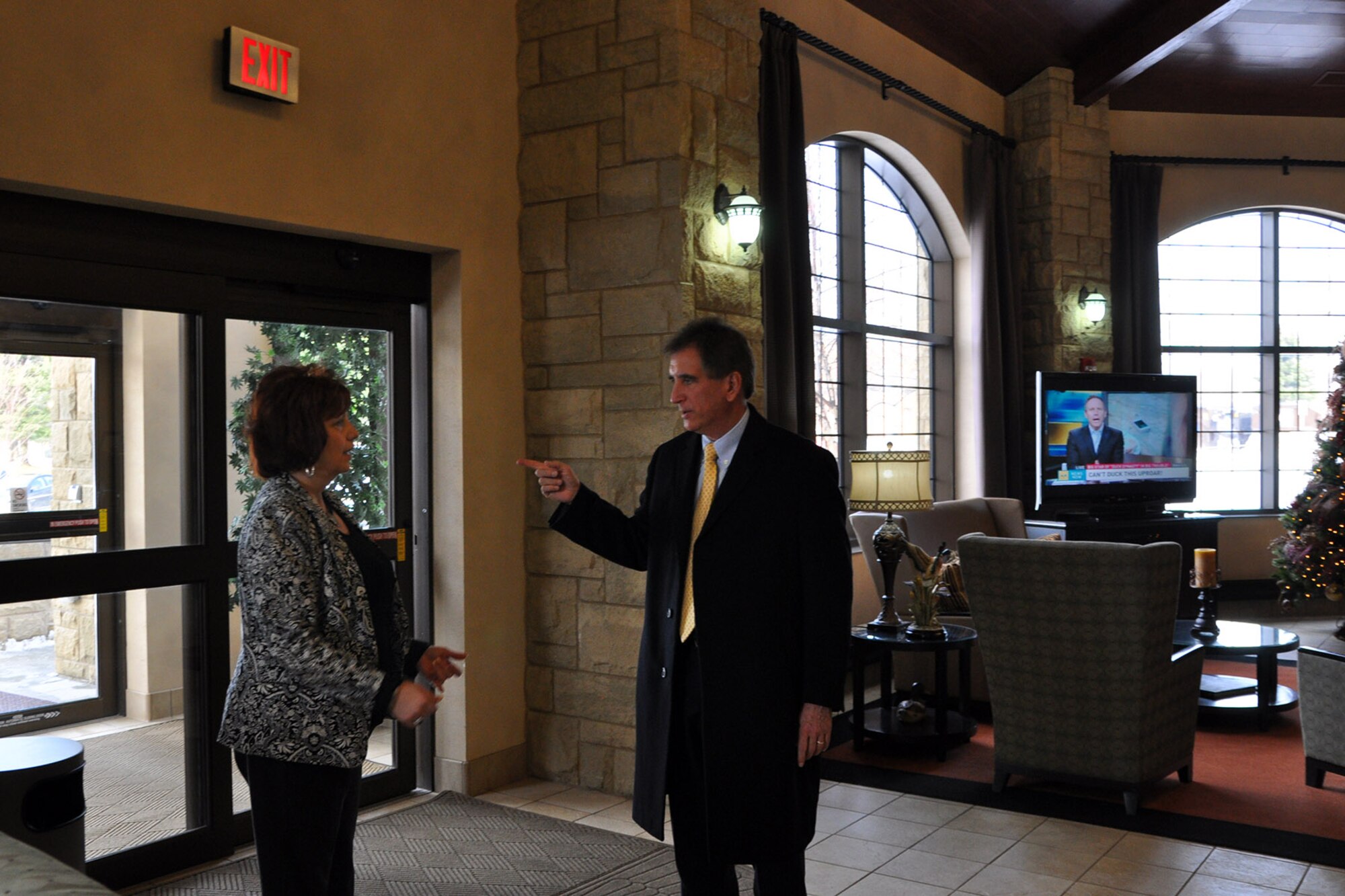 YOUNGSTOWN AIR RESERVE STATION, Ohio – Congressman Jim Renacci, of Ohio’s 16th district, (right) talks about facilities amenities with Air Force Reserve 910th Chief of Services Nancy Rubino (right) in the lobby of the Eagle’s Nest Lodge here, Dec. 19, 2013. Following a group meal at the adjacent YARS Community Activity Center, Congressman Renacci continued his installation visit with a tour of the 123-room Eagle’s Nest Lodge. The tour of the lodging facility was guided by Mrs. Rubino. The congressman visited YARS to learn more about the wing’s capabilities and the installation’s features firsthand as well as meet some of the Citizen Airmen assigned here. U.S. Air Force photos by Master Sgt. Bob Barko Jr.