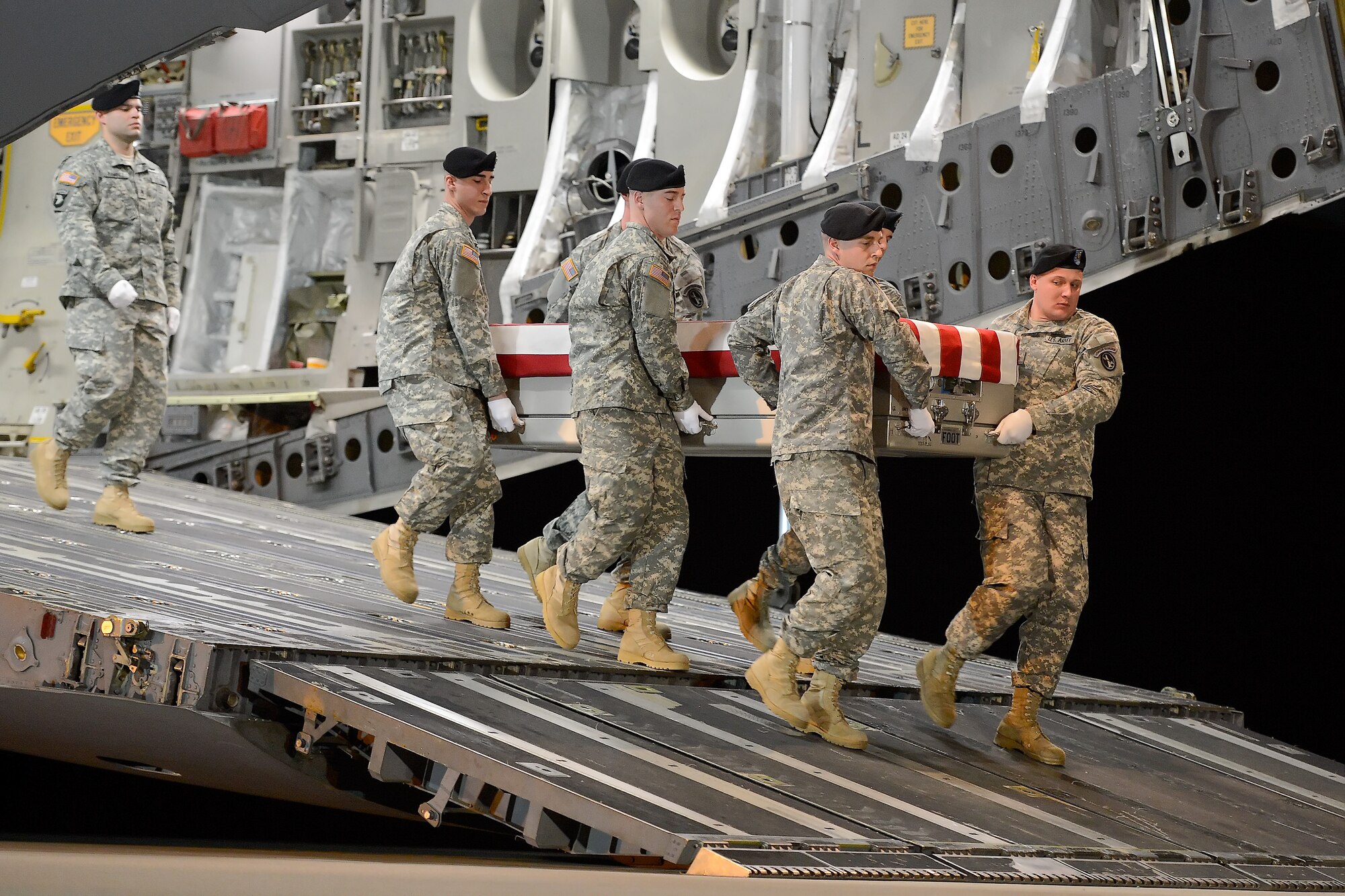 A U.S. Army carry team transfers the remains of Spc. Terry K. D. Gordon, of Shubata, Miss., during a dignified transfer Dec. 19, 2013 at Dover Air Force Base, Del. Gordon was assigned to the 1st Squadron, 6th Cavalry Regiment, 1st Combat Aviation Brigade, 1st Infantry Division, Fort Riley, Kan. (U.S. Air Force photo/Greg L. Davis)