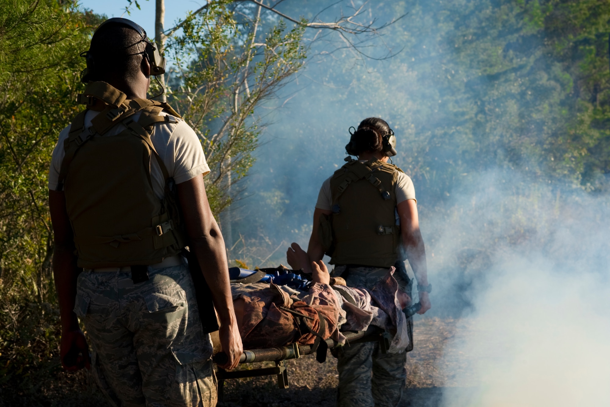 Air Force Special Operations Command Casualty Evacuation course students carry a simulated critically wounded patient to an aircraft on Hurlburt Field, Fla., Dec. 18, 2013. The CASEVAC course tests the medical team’s ability to treat patients in a simulated combat environment. (U.S Air Force photo/Senior Airman Naomi Griego)