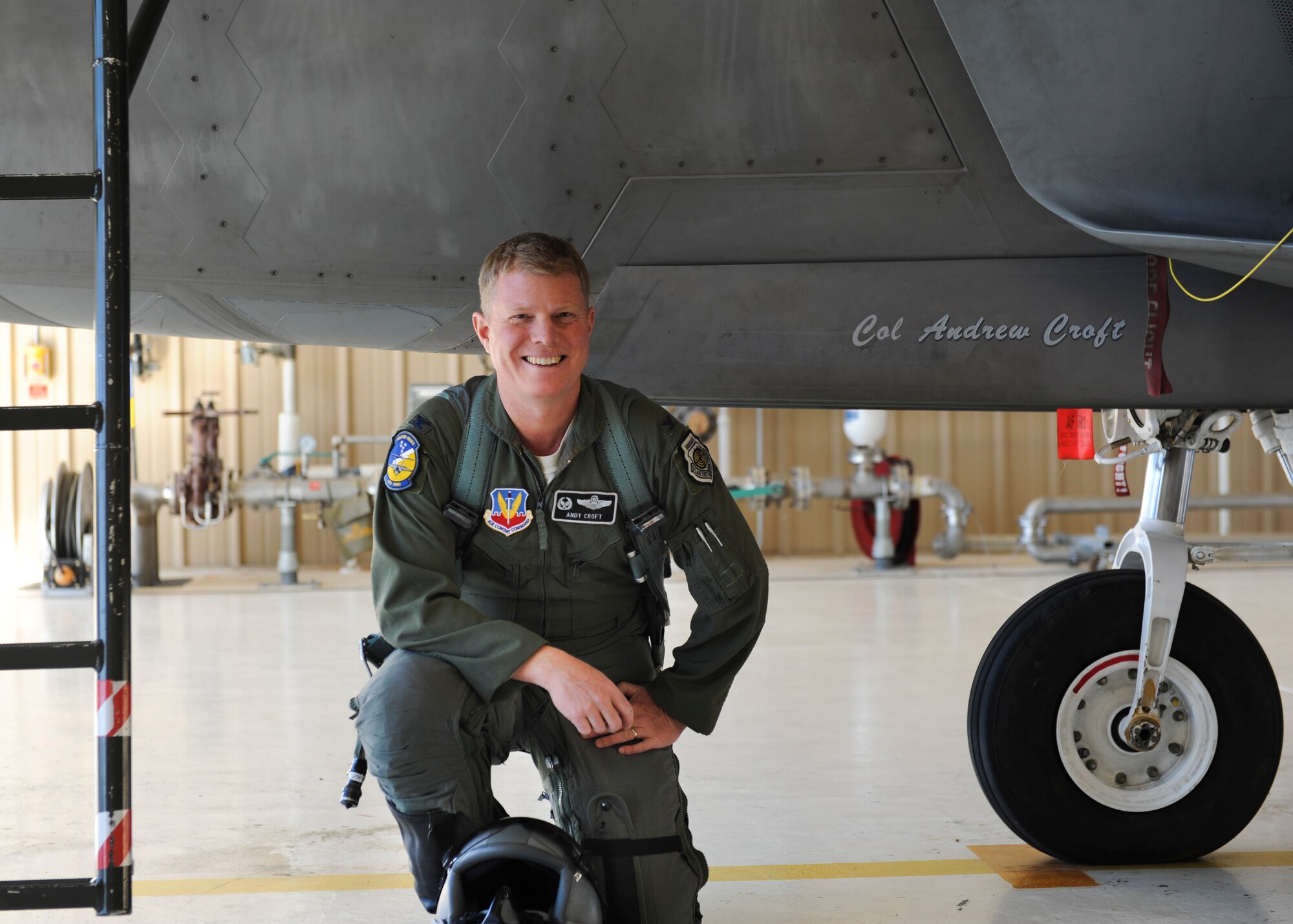 Colonel Andrew Croft, 49th Wing commander, poses for a farewell photo with his F-22 Raptor at Holloman Air Force Base, N.M., Dec. 17. The first five F-22 Raptors are scheduled to leave Jan. 6, 2014, for Tyndall Air Force Base, Fla. as part of Holloman’s transition from F-22 Raptor operations to F-16 Fighting Falcon training.(U.S. Air Force photo by Senior Airman Colin Cates/Released) 
 
