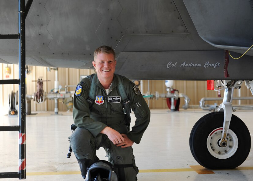 Colonel Andrew Croft, 49th Wing commander, poses for a farewell photo with his F-22 Raptor at Holloman Air Force Base, N.M., Dec. 17. The first five F-22 Raptors are scheduled to leave Jan. 6, 2014, for Tyndall Air Force Base, Fla. as part of Holloman’s transition from F-22 Raptor operations to F-16 Fighting Falcon training.(U.S. Air Force photo by Senior Airman Colin Cates/Released) 
 
