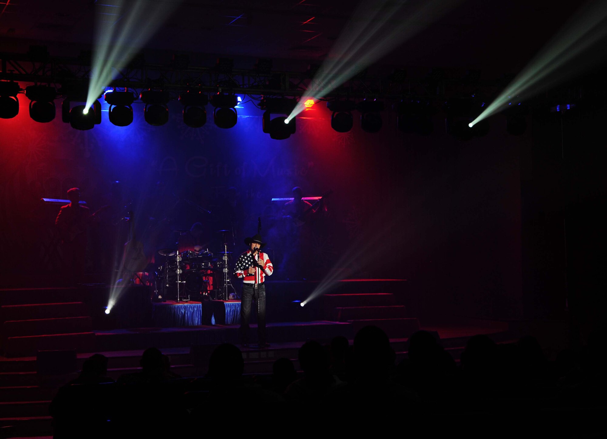 Ryan Daniel, Tops and Blue vocalist, performs to members of The Rock during “A Gift of Music” tour. Ryan served as a pride member of the Air Force for nine years. Tops In Blue is one of the oldest and most  widely traveled entertainment groups of its kind. (U.S. Air Force photo by Senior Airman Desiree W. Moye) 