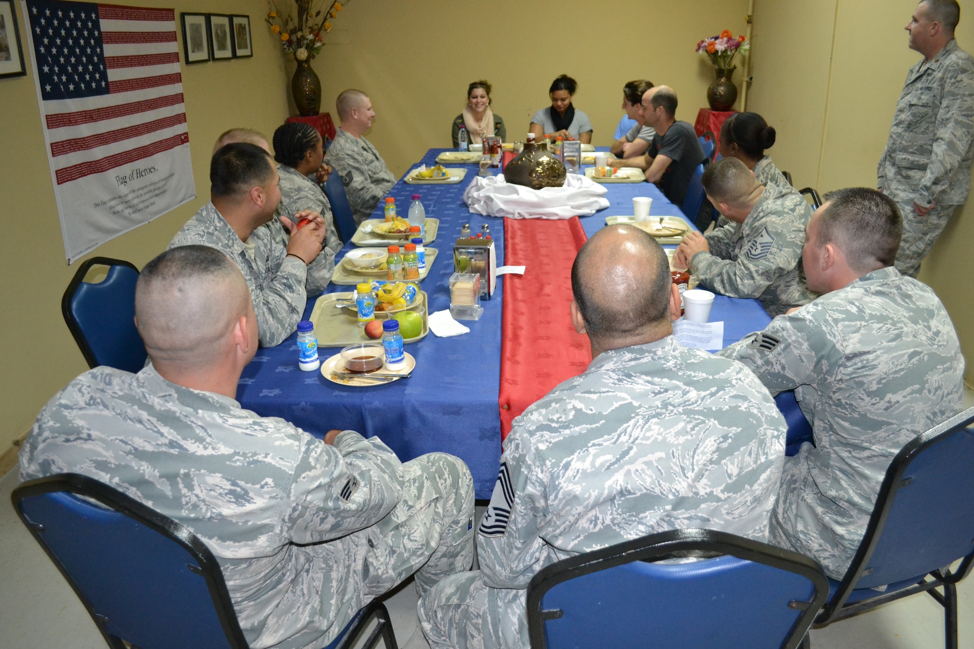 Members of the 379th Expeditionary Force Support Squadron enjoy breakfast with Alaina Blair, a country music artist who performed for service members at the 379th Air Expeditionary Wing in Southwest Asia, Dec. 19, 2013.  Alaina Blair, along with her band, performed 11 concerts in five countries across the U.S. Air Forces Central Command area of responsibility over an 18 day period.  Blair sang a mix of her own music, cover songs and Christmas carols to the audience, providing an interactive performance while spreading holiday cheer.  (U.S. Air Force photo/Maj. Nicole David)