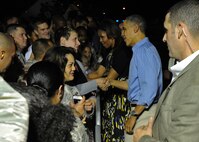 President of the United States Barack Obama is greeted by Airmen and their families upon his arrival to the Hickam flightline at Joint Base Pearl Harbor-Hickam, Hawaii on Dec. 20, 2013. President Obama, a native of Hawaii, is home for the Holidays. (U.S. Air Force photo/Master Sgt. Jerome S. Tayborn)