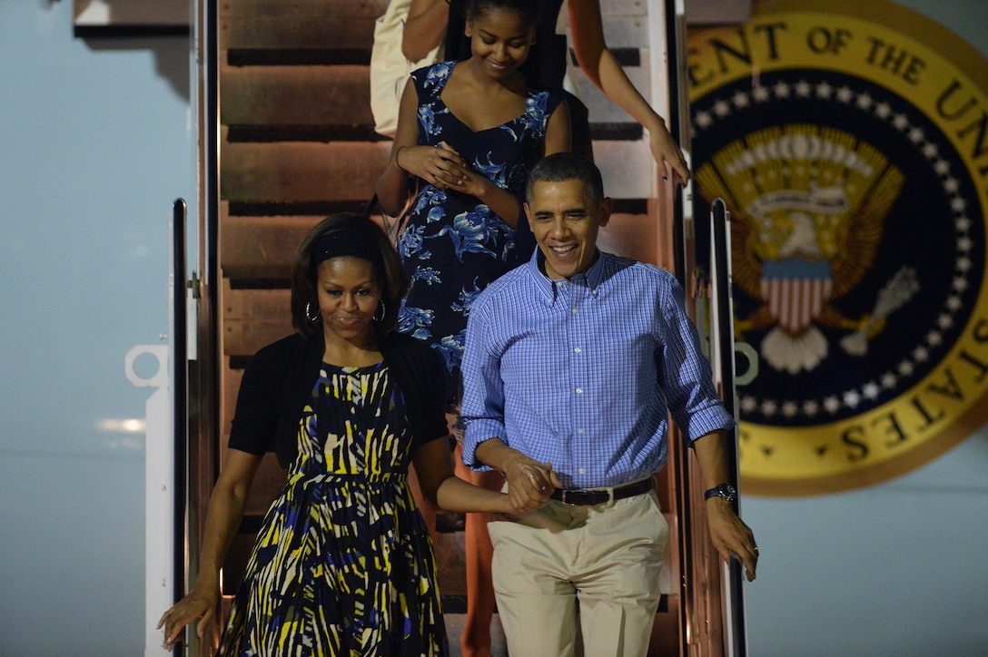 President Obama and the First Family arrive at the Hickam flightline on-board Air Force One, at Joint Base Pearl Harbor-Hickam, Hawaii, Dec. 20, 2013, to kick off their 2013 holiday vacation. (U.S. Air Force photo/Staff Sgt. Alex Martinez)