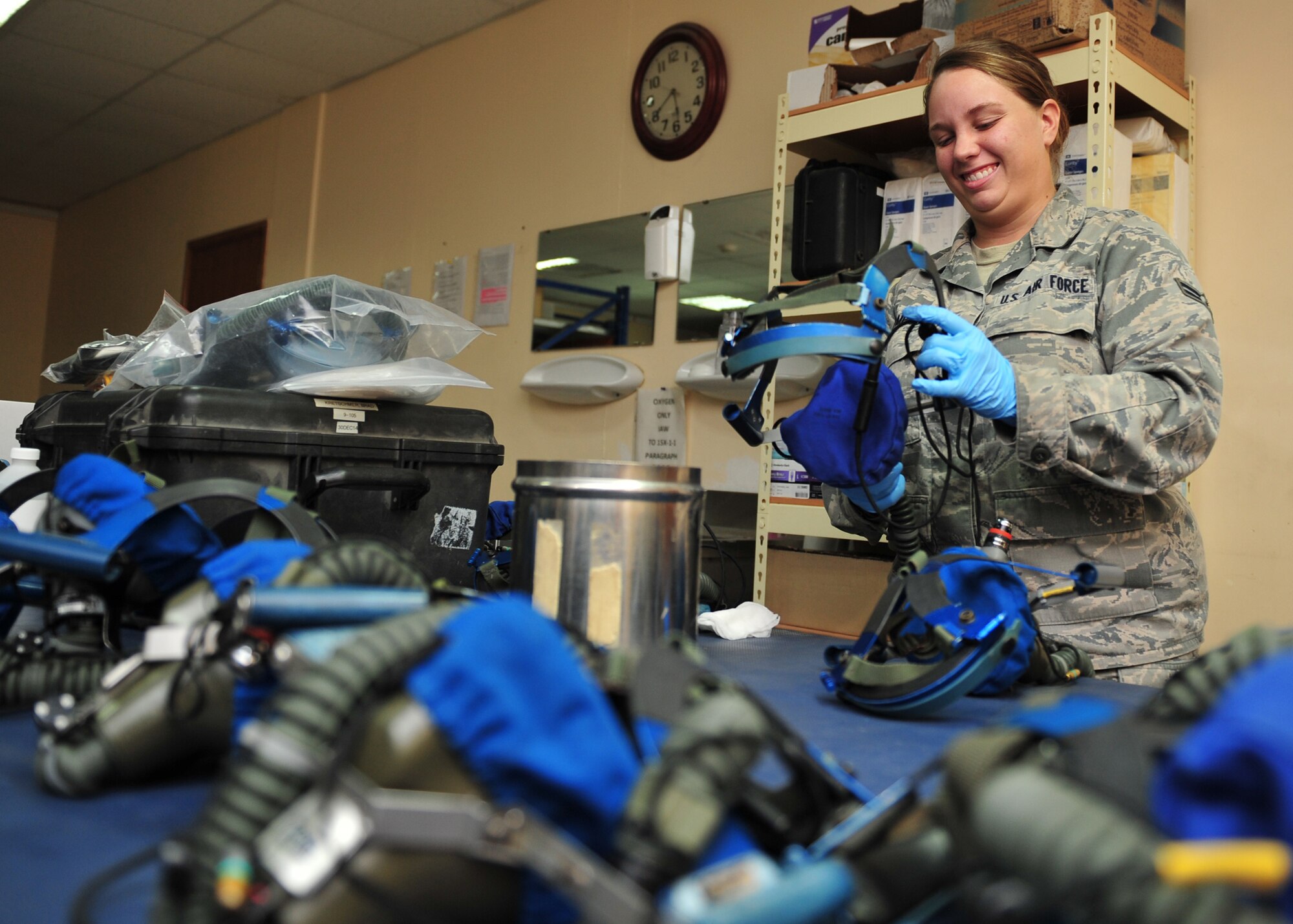 Air Force Airman 1st Class Prestley Thompson, an Aircrew Flight Equipment techncian assigned to the 380th Expeditionary Operations Support Squadron here, cleans and inspects equipment at an undisclosed location in Southwest Asia, Dec. 17, 2013. Thompson is deployed from Joint Base Tinker Air Force Base, Okla. (U.S. Air Force photo by Staff Sgt. Michael Means/Released)