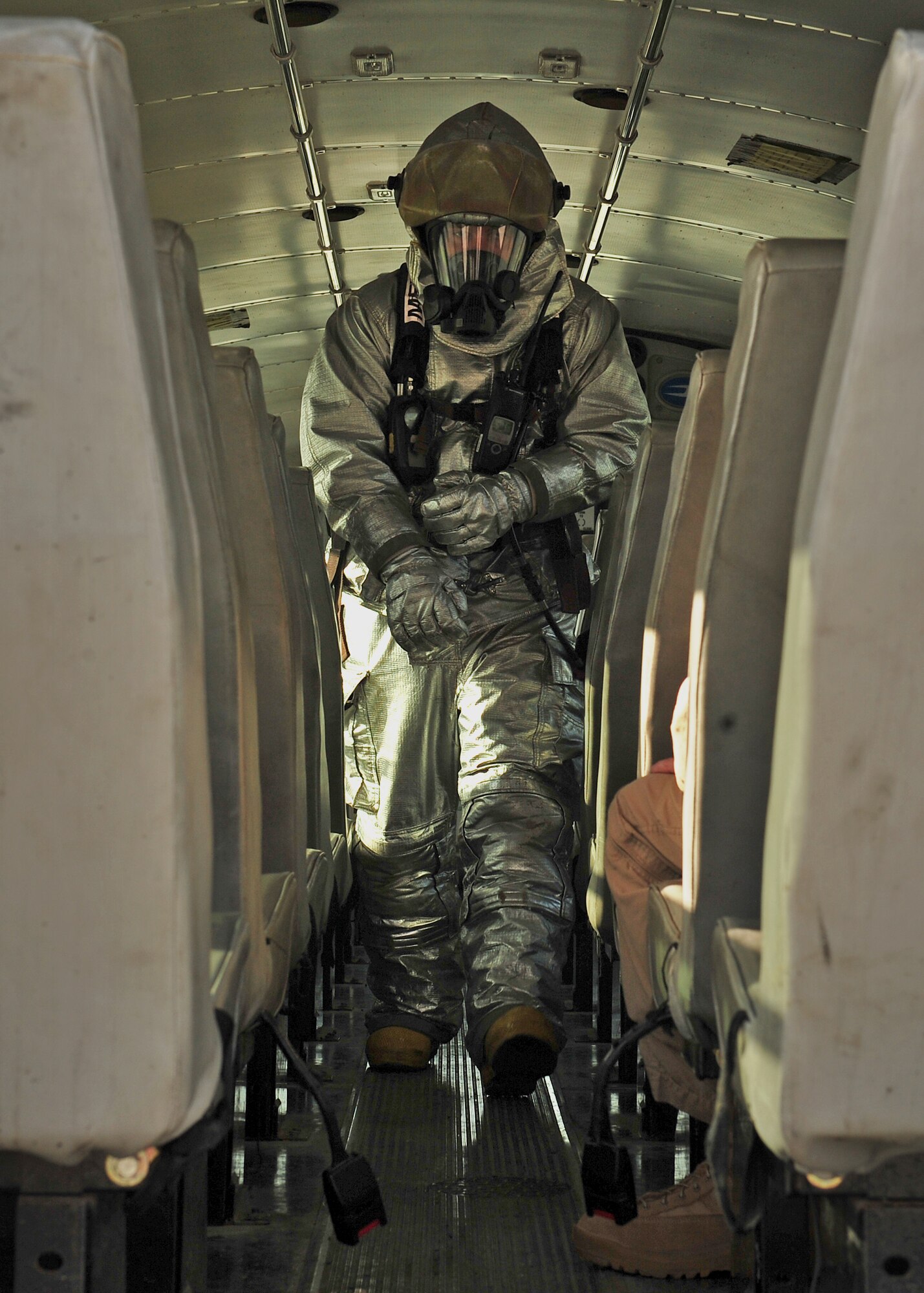 A firefighter assigned to the 380th Expeditionary Civil Engineer Squadron here searches for vitims during a Major Accident Response Exercise at an undisclosed location in Southwest Asia, Dec. 19, 2013. The MARE is to ensure members of the wing can appropriately respond to a major accident. (U.S. Air Force photo by Staff Sgt. Michael Means/Released)