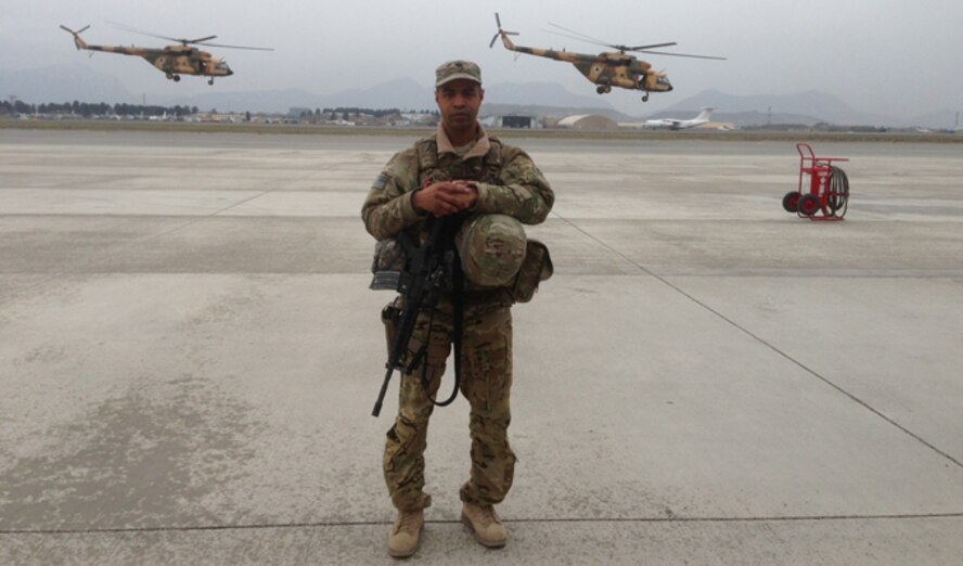 Lt. Col. Howard Gentry stands on the 438th Expeditionary Wing airfield in Kabul, Afghanistan, during his 2012 deployment. Gentry volunteered for his first deployment because he wanted to make a difference, he said. He served as the deputy group commander of Kabul's 438th Air Expeditionary Advisory Wing. (Courtesy photo)