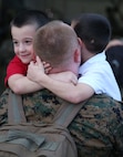 Marines with Marine Light Attack Helicopter Squadron (HMLA) 167 return home to awaiting families and friends at the squadron’s hangar aboard Marine Corps Air Station New River, Dec. 5. The Marines were deployed for more than three months to Okinawa, Japan, as part of the Unit Deployment Program.
