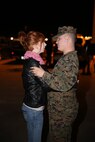 A Marine from Marine Heavy Helicopter Squadron (HMH) 464 says goodbye to his wife before he departs for Japan, Dec. 12. Approximately 50 Marines of HMH-464 left their hangar aboard Marine Corps Air Station New River to deploy to Japan as part of the Unit Deployment Program, Dec. 2.