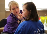 A Special Olympics volunteer paints one of the athletes faces, one of the many events held at this year’s games. Marine Corps Air Station New River, in partnership with Special Olympics Onslow County hosted the 14th annual Special Olympics Fall Games at the AS-4400 fitness center, Dec. 6.

