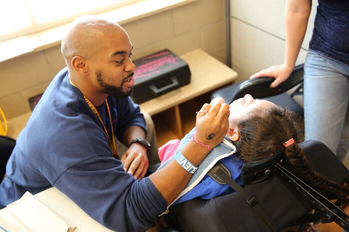 A Special Olympics volunteer paints one of the athletes faces, one of the many events held at this year’s games. Marine Corps Air Station New River, in partnership with Special Olympics Onslow County hosted the 14th annual Special Olympics Fall Games at the AS-4400 fitness center, Dec. 6.
