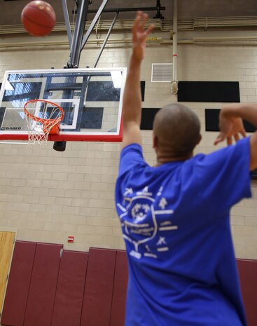 A Special Olympics athlete takes a shot from one of six different positions around the court, one of many games offered at this yea’s games. Marine Corps Air Station New River, in partnership with Special Olympics Onslow County hosted the 14th annual Special Olympics Fall Games at the AS-4400 fitness center, Dec. 6.
