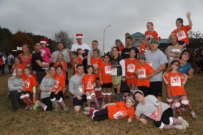 Girls on a Run from Delalio Elementary School aboard Marine Corps Air Station New River pose for a photo after running a 5K, Dec. 7. 