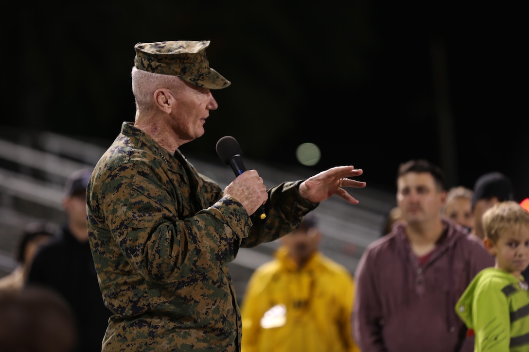 Lt. Gen. John Toolan, the commanding general of I Marine Expeditionary Force, says a few words to the football players and spectators after the championship game at Paige Field House, Nov. 19. Toolan described the benefits of team sports such as football.


