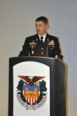 Lt. Col. John Hudson, U.S. Army Corps of Engineers Nashville District commander, presents outgoing President Bryon Olsen a plaque after being installed as president of the Society of American Military Engineers Nashville Post during a meeting Dec. 18, 2013 in the Tennessee Engineering Center at the Adventure Science Center in Nashville, Tenn. (USACE photo by Mark Rankin) 