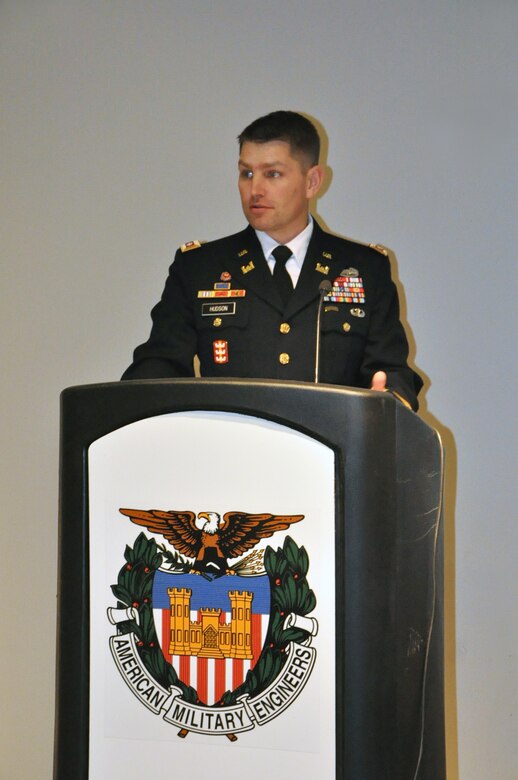 Lt. Col. John Hudson, U.S. Army Corps of Engineers Nashville District commander, presents outgoing President Bryon Olsen a plaque after being installed as president of the Society of American Military Engineers Nashville Post during a meeting Dec. 18, 2013 in the Tennessee Engineering Center at the Adventure Science Center in Nashville, Tenn. (USACE photo by Mark Rankin) 