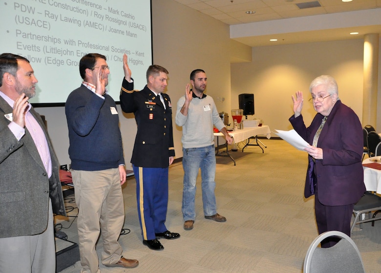 Laveda Parton gives the the installed members of the Society of American Military Engineers Nashville Post the oath of office during a meeting Dec. 18, 2013 in the Tennessee Engineering Center at the Adventure Science Center in Nashville, Tenn. (USACE photo by Mark Rankin) 
