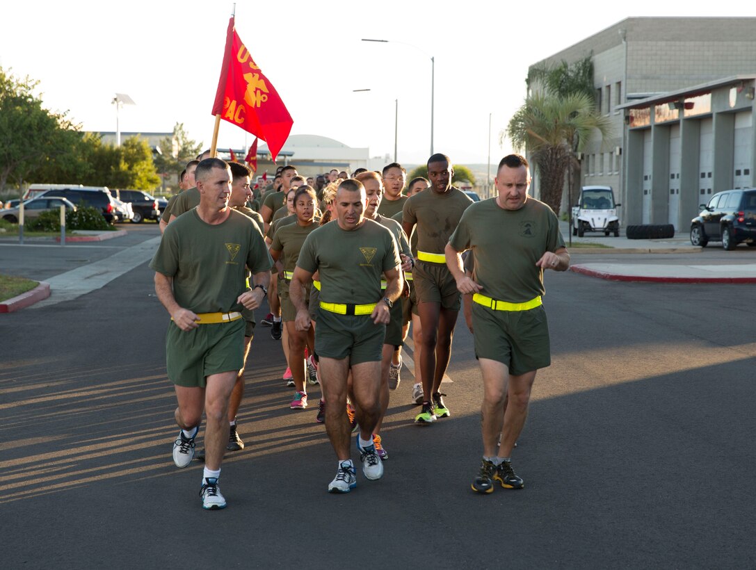 Col. John Farnam, Marine Corps Air Station Miramar commanding officer, Sgt. Maj. Richard Charron, MCAS Miramar sergeant major and Lt. Col. Daniel Levasseur, Headquarters and Headquarters Squadron commanding officer, lead a mass of Marines during the 238th Marine Corps birthday run aboard Marine Corps Air Station Miramar, Calif., Nov. 7. The Marines also held a traditional cake cutting ceremony the same day.


