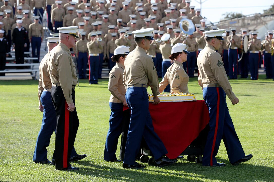 Marines escort the ceremonial cake during a 238th birthday cake cutting ceremony aboard Marine Corps Air Station Miramar, Calif., Nov. 7. The cake cutting ceremony symbolizes the passing of wisdom from the oldest Marine to the youngest Marine.


