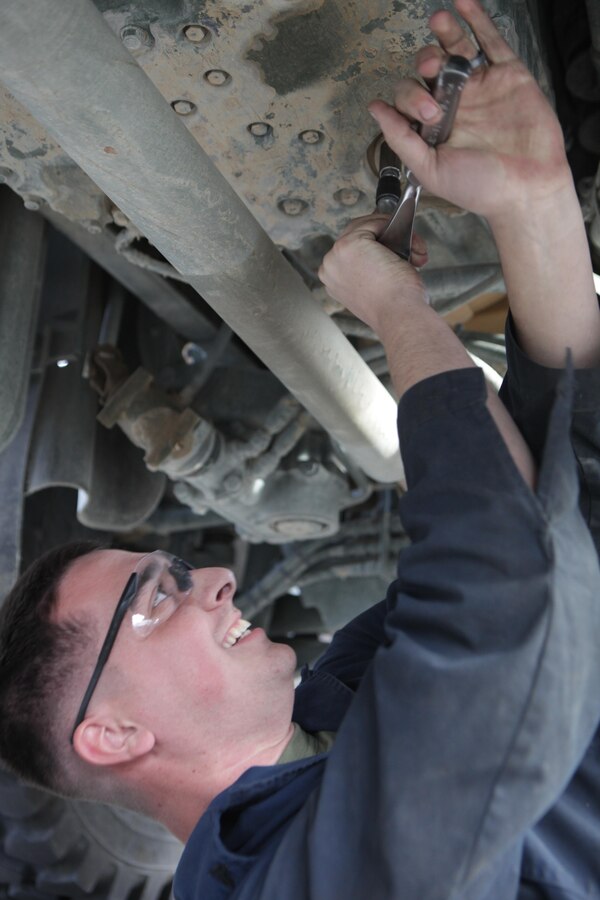 Cpl. Matthew Bodnar, a Motor Technician Mechanic with Combat Logistics Battalion 25, Combat Logistics Regiment 45 works on a truck at the Marine Corps Air Ground Combat Center’s Enhanced Equipment Allowance Pool here Dec. 16, 2013. 
