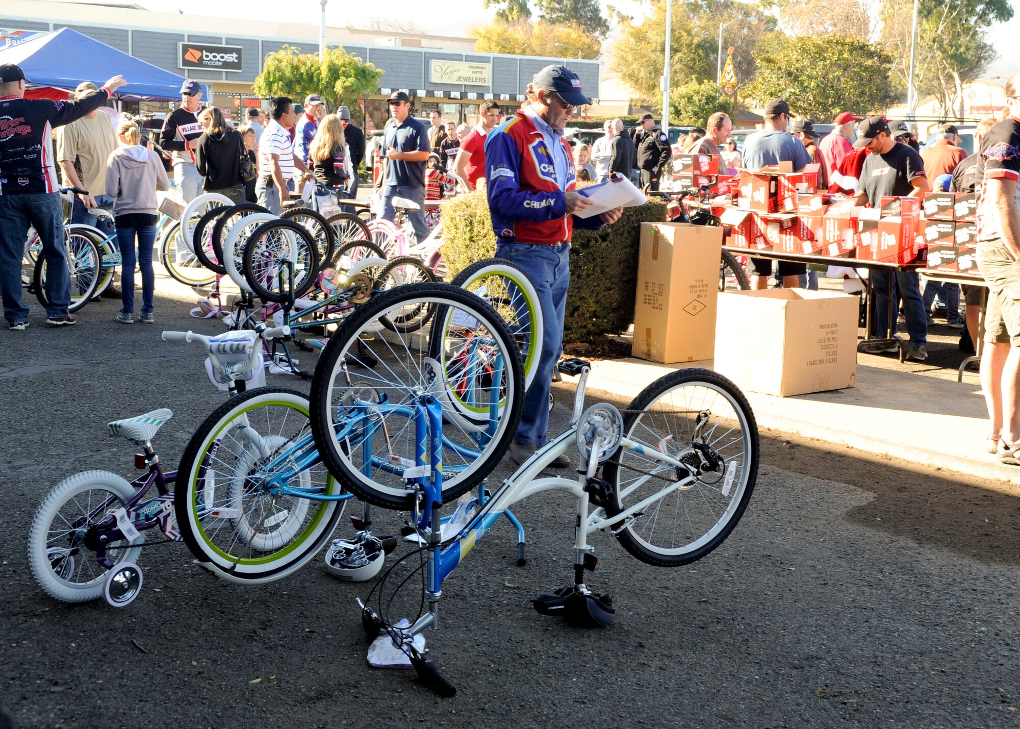 LOMPOC, Calif. – Bicycles and helmets provided by a local cycling group, The Village Dirtbags, and the local community are given to Team V dependants in Lompoc Saturday, Dec. 21, 2013. This event marked the 8th annual Christmas Bikes for Vandenberg Air Force Base military children. All bikes and helmets where purchased through Bicycle Unlimited for families with deployed spouses and single income families. (U.S. Air Force photo/ Airman 1st Class Yvonne Morales)