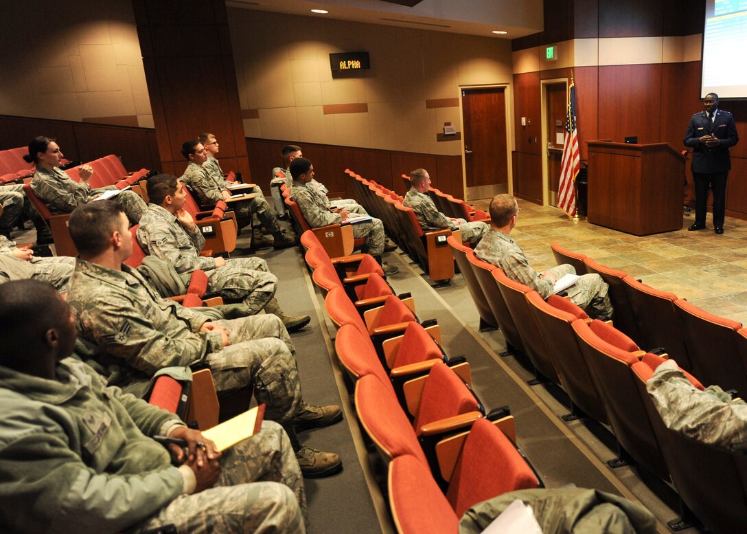 Second Lt. Joseph Okai, Air Force Academy admissions officer, gives an information briefing to enlisted Airmen about the Leaders Encouraging Airmen Development program at Ellsworth Air Force Base, S.D., Dec. 20, 2013. Upon completion of the program, LEAD Airmen enter the Air Force as second lieutenants with a bachelor degree and train in one of many career fields including intelligence, aviation and engineering. (U.S. Air Force photo by Senior Airman Anania Tekurio/Released) 