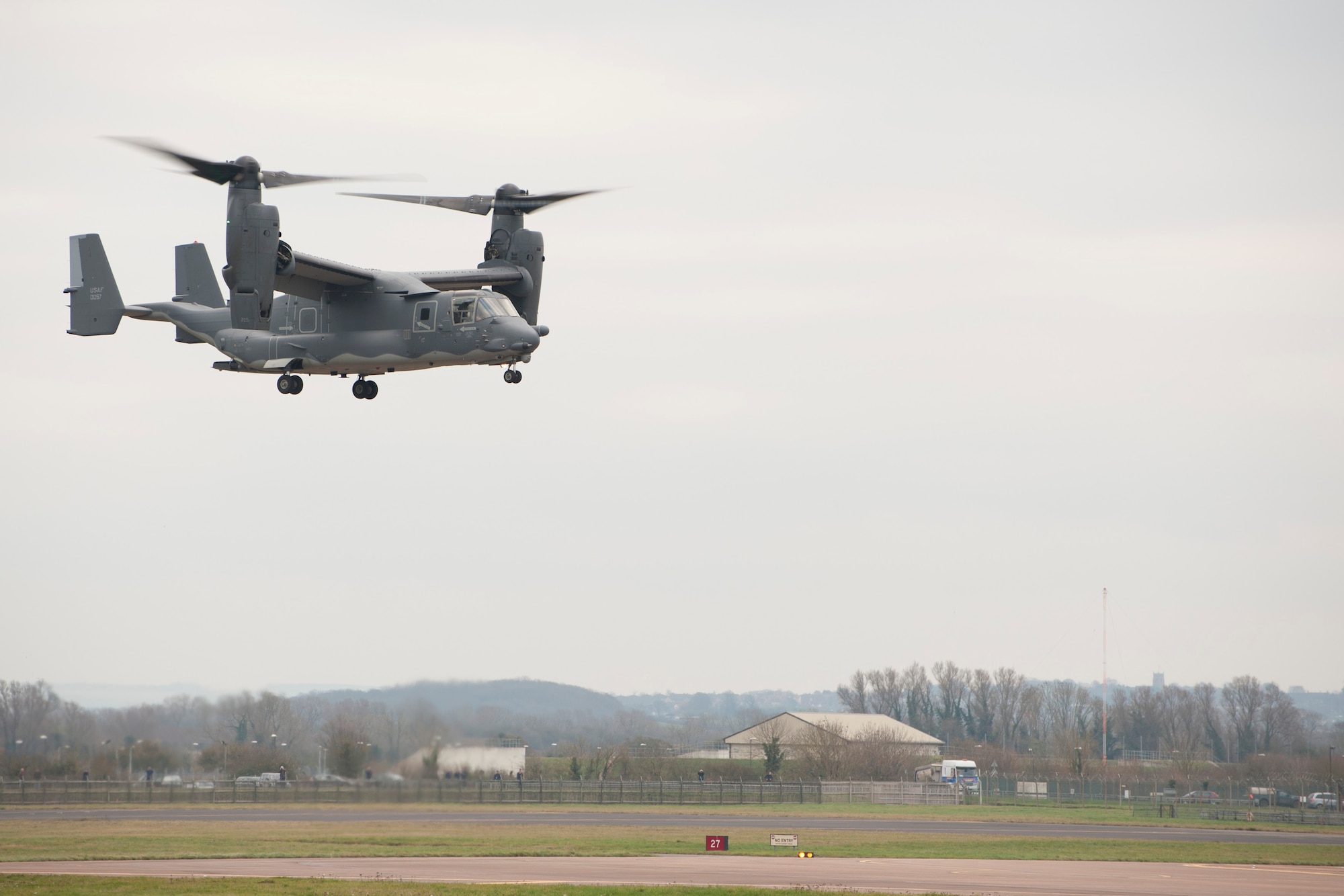 A CV-22 Osprey from the 7th Special Operations Squadron hovers during an exercise at RAF Fairford, England, Dec. 10, 2013. The 352nd Special Operations Group conducted an exercise involving approximately 130 Airmen and six aircraft at RAF Fairford from Dec. 9-12. The CV-22 Osprey is a tiltrotor aircraft that combines the vertical takeoff, hover and vertical landing capabilities of a helicopter with the long range, fuel efficiency and speed characteristics of a turboprop aircraft. (U.S. Air Force photo by Staff Sgt. Stephen Linch/Released)
