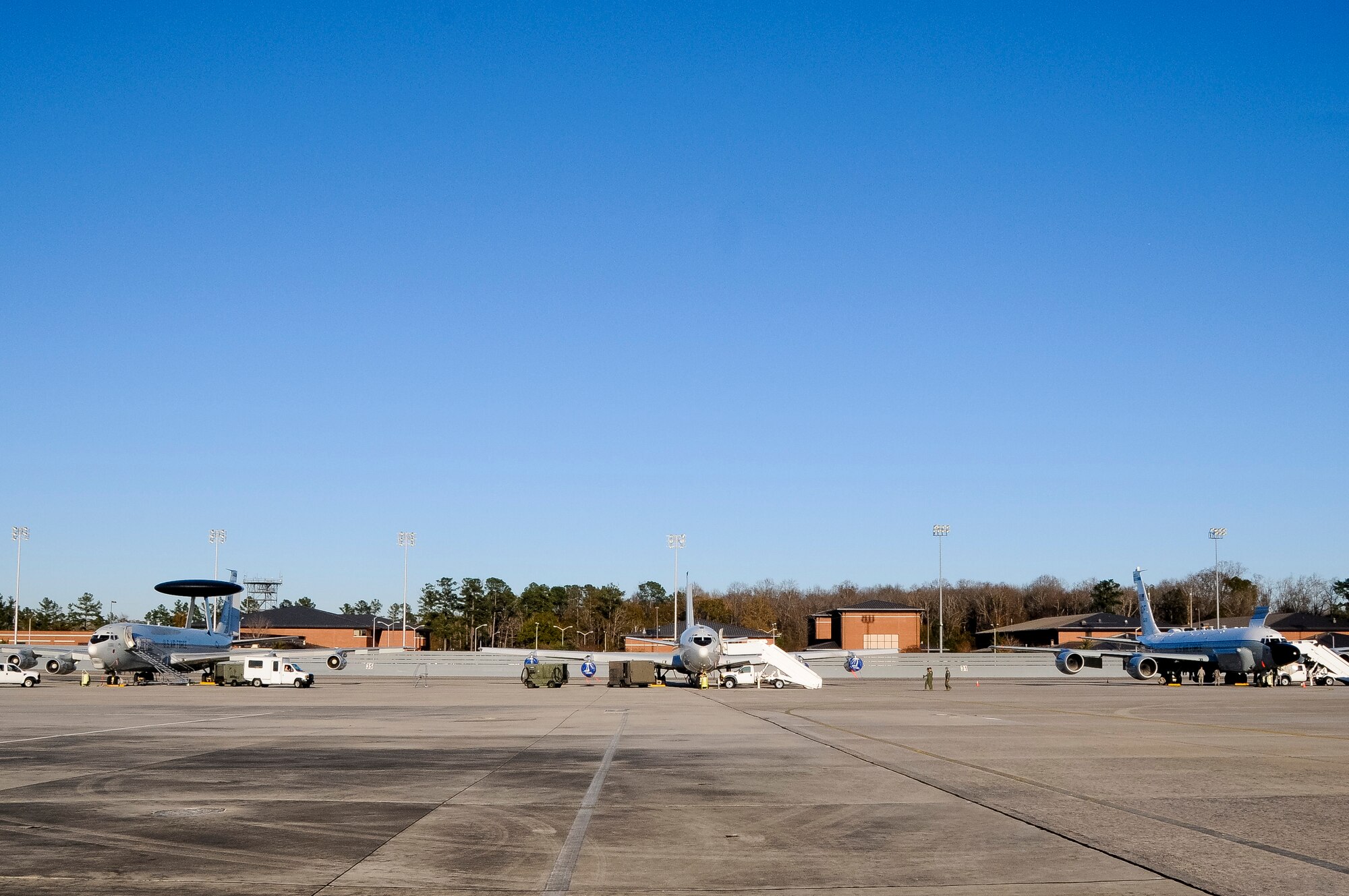 An E-3 Sentry AWACS, left, an E-8C Joint STARS and an RC-135 RIVETJOINT share a rare moment together on the flightline at Robins Air Force Base, Ga., Dec. 12, 2013. The three platforms, known as the Iron Triad, were at Robins to participate in a command and control (C2) joint force exercise hosted by Team JSTARS. The exercise was conducted to practice interoperability between multiple C2 platforms. (U.S. Air National Guard photos by Capt. Pamela Stauffer/Released)