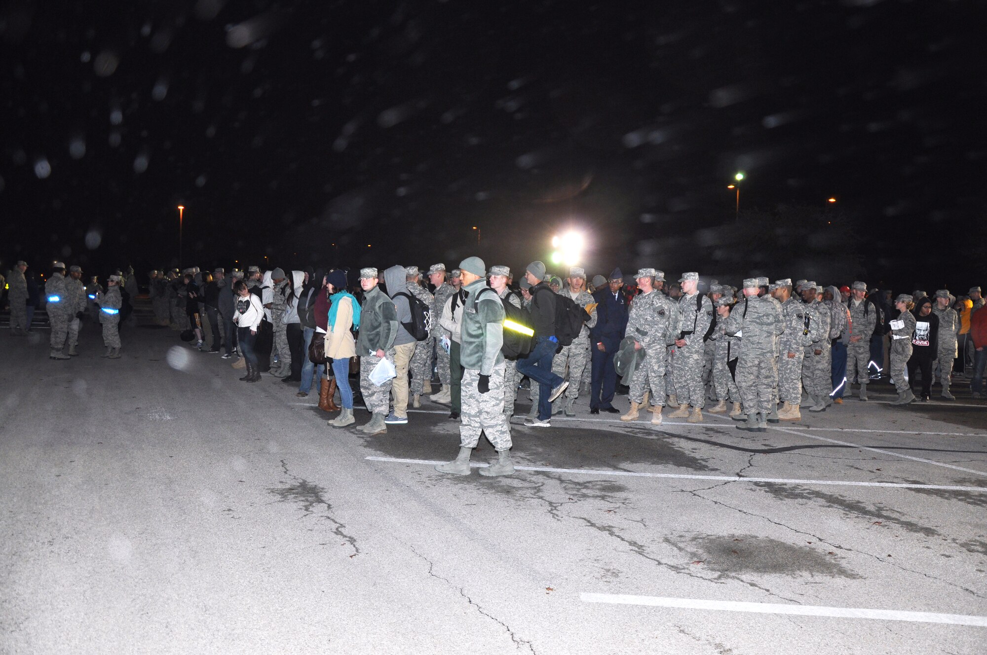 GOODFELLOW AIR FORCE BASE, Texas – Service members wait to be called into the Carswell Field House for their exodus bus Dec. 20. Once inside, the service members picked up their luggage from a queue line and made their way to their bus for exodus, the annual release for the winter holidays. (U.S. Air Force photo/ Senior Airman Joshua Edwards)