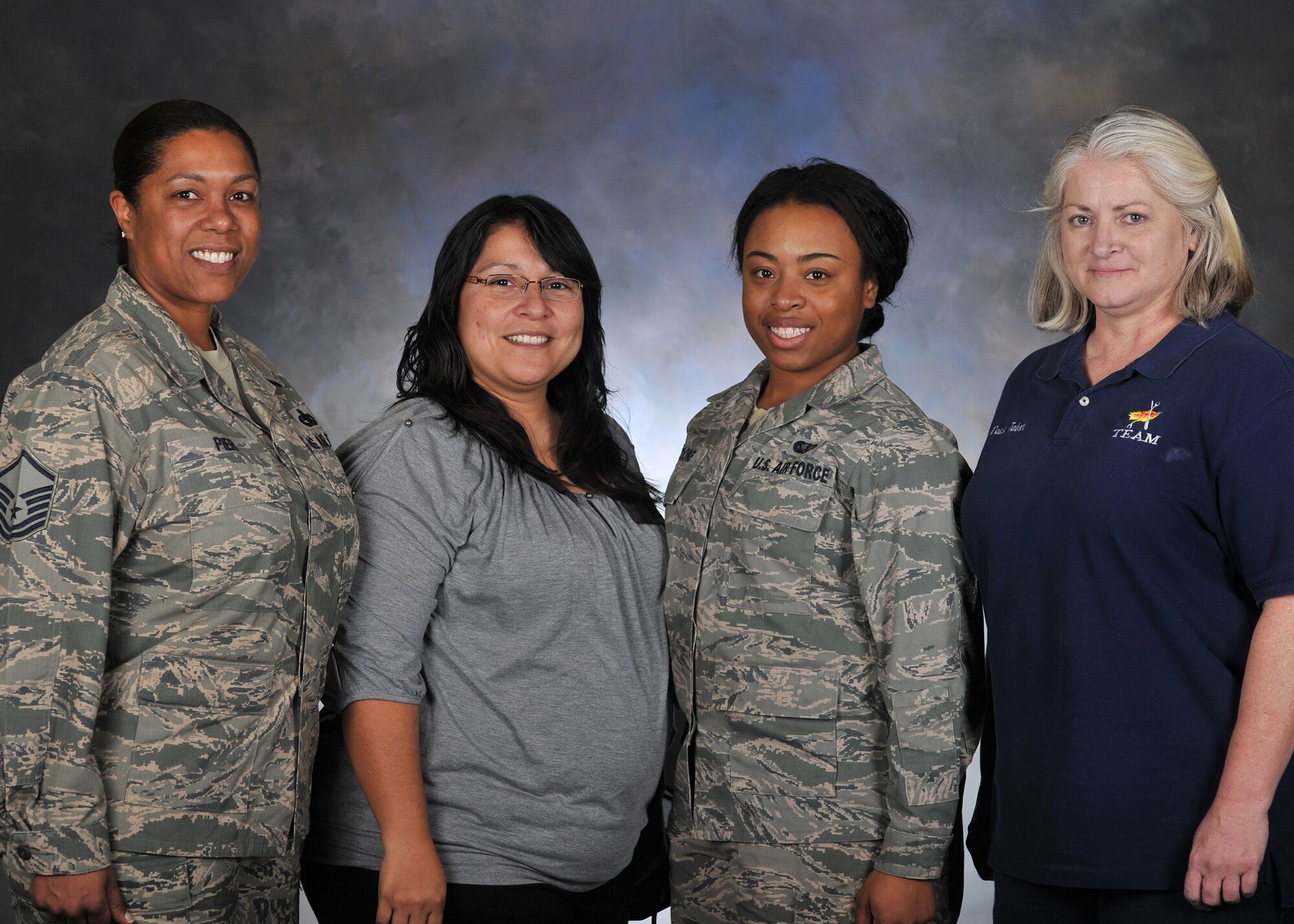 ALTUS AIR FORCE BASE, Okla. – From left to right, Master Sgt. Danielle Pier, Rosie Rosalez, Senior Airman Kanesha Boone and Dawn Tabor present themselves as the new Sexual Assault Prevention and Response victim advocates Dec. 20, 2013. The new volunteers will join the eight current victim advocates on Altus AFB as first line responders to sexual assaults. (U.S. Air Force photo by Senior Airman Levin Boland/Released)