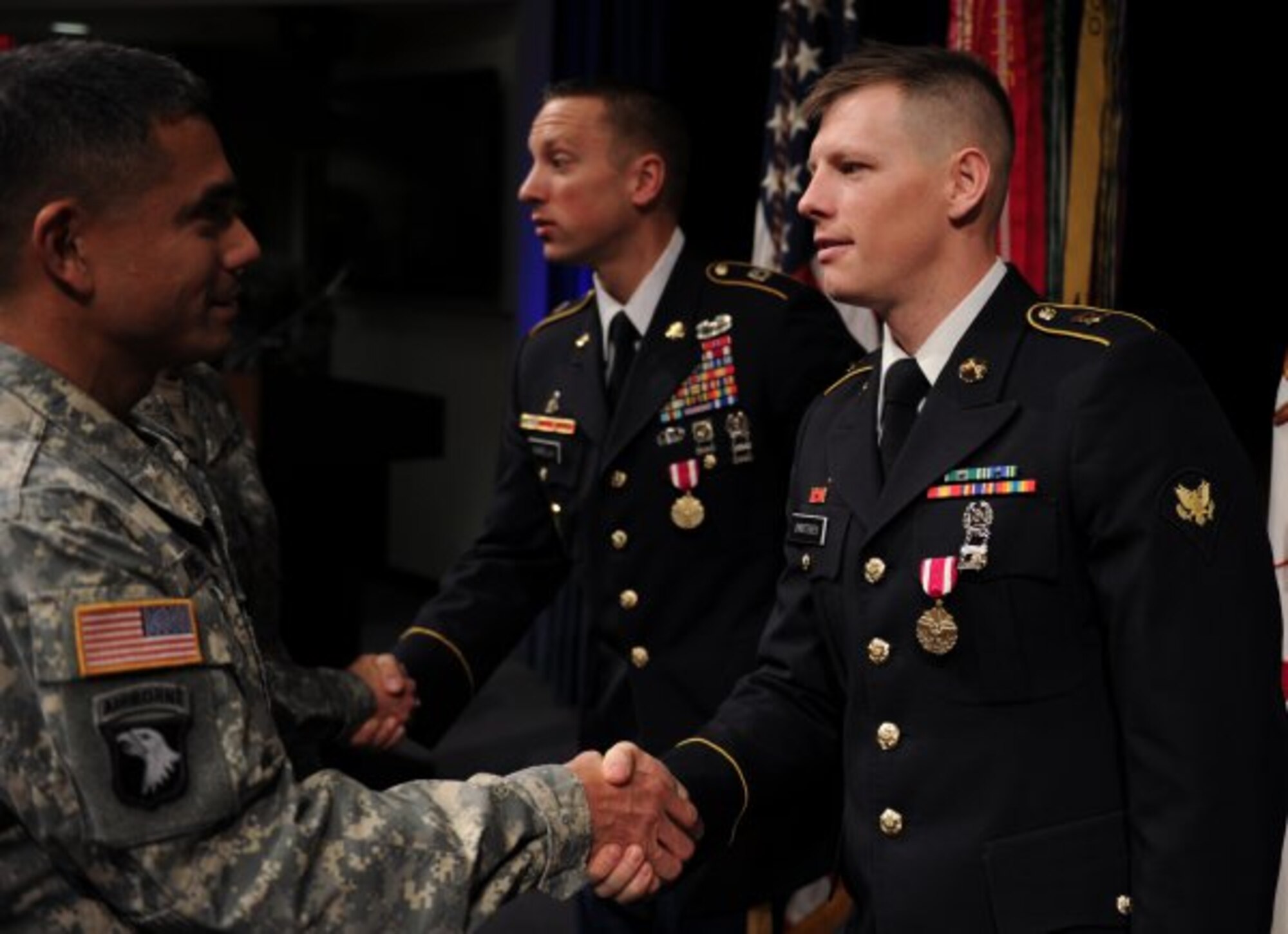 Spc. Adam Christensen and Sgt. 1st Class Jason Manella are congratulated by fellow Soldiers for their accomplishments in winning the 2013 Soldier and NCO of the Year. In a ceremony at the Pentagon, Dec. 18, 2013, both Soldiers were presented Meritorious Service Medals by Army Chief of Staff Gen. Ray Odierno and Sgt. Maj. of the Army Raymond F. Chandler III.