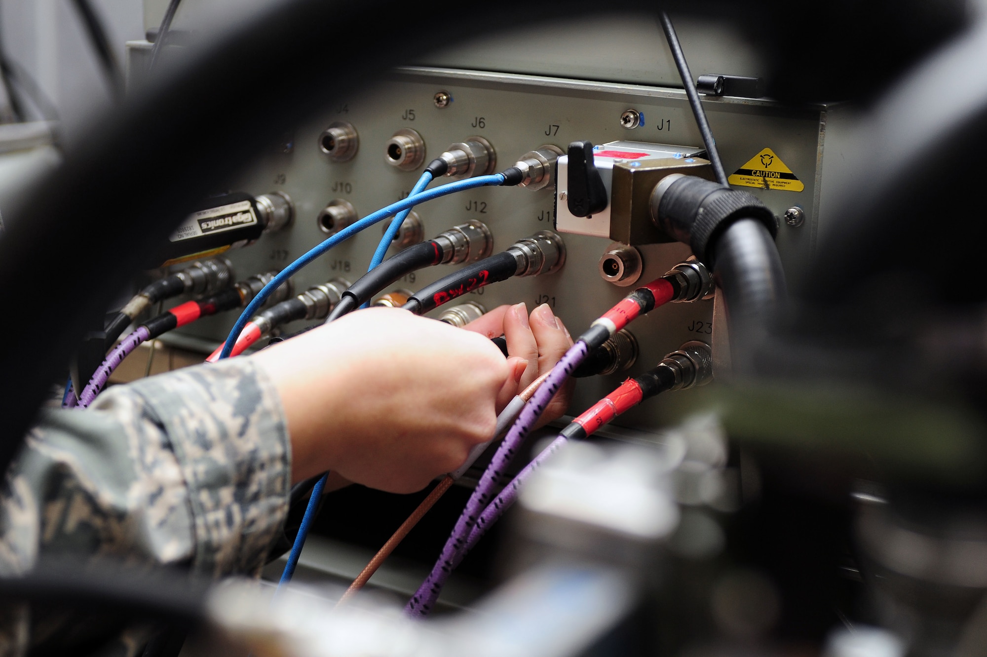 Staff Sgt. Christine Hoffman, 4th Component Maintenance Squadron avionics technician, troubleshoots an F-15E Strike Eagle aircraft radar system on a test station at Seymour Johnson Air Force Base, N.C., Dec. 19, 2013. Troubleshooting is a series of tests that determine where the discrepancies of a malfunctioning object are. (U.S. Air Force photo by Senior Airman John Nieves Camacho)