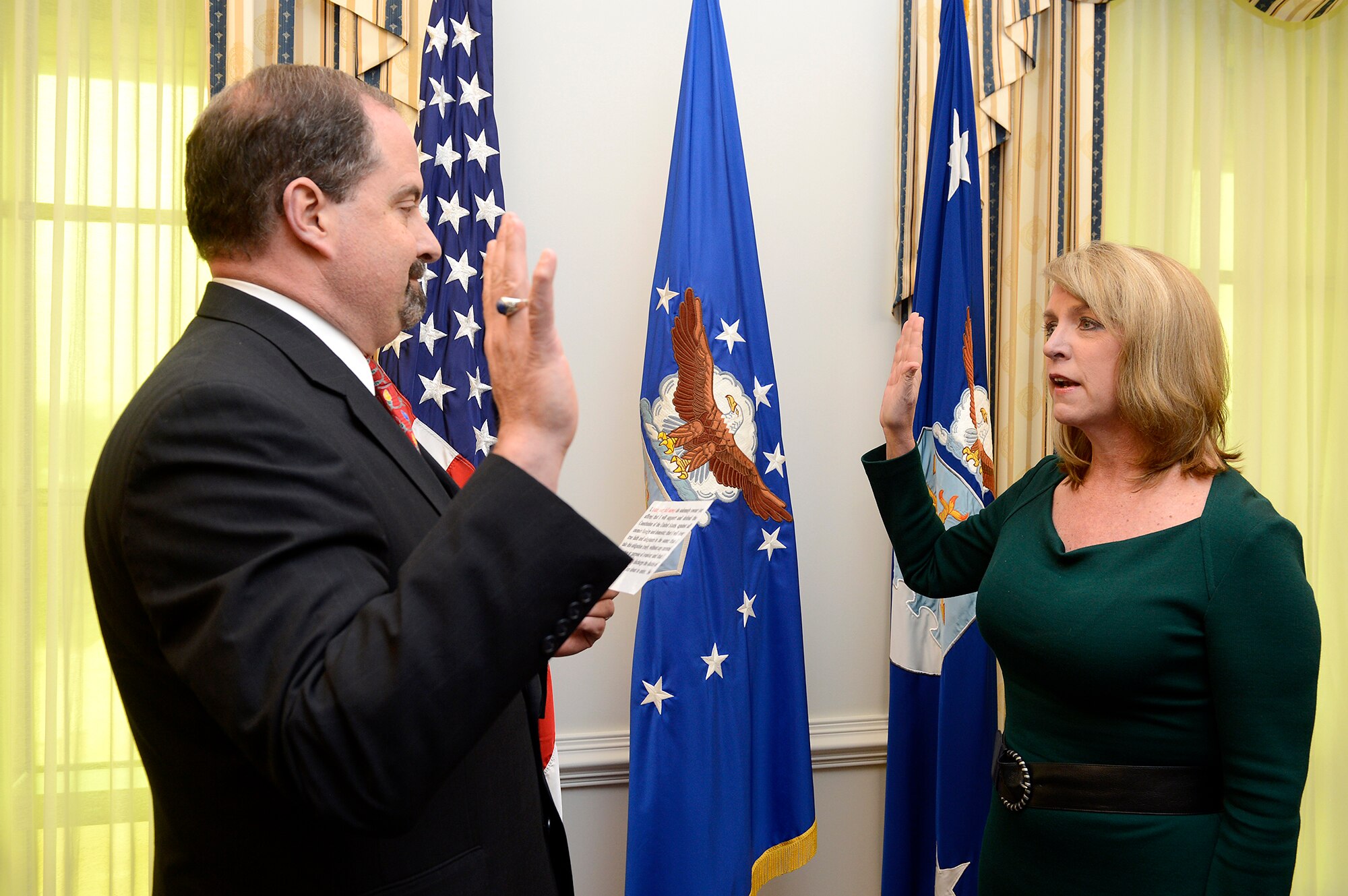 Timothy Beyland (left) swears in Deborah Lee James as the 23rd Air Force secretary Dec. 20, 2013, at the Pentagon. James is responsible for the affairs of the Department of the Air Force, including the organizing, training, equipping and providing for the welfare of its more than 690,000 active-duty, Guard, Reserve and civilian Airmen and their families. Beyland is the administrative assistant to the secretary of the Air Force. (U.S. Air Force photo/Scott M. Ash) 
