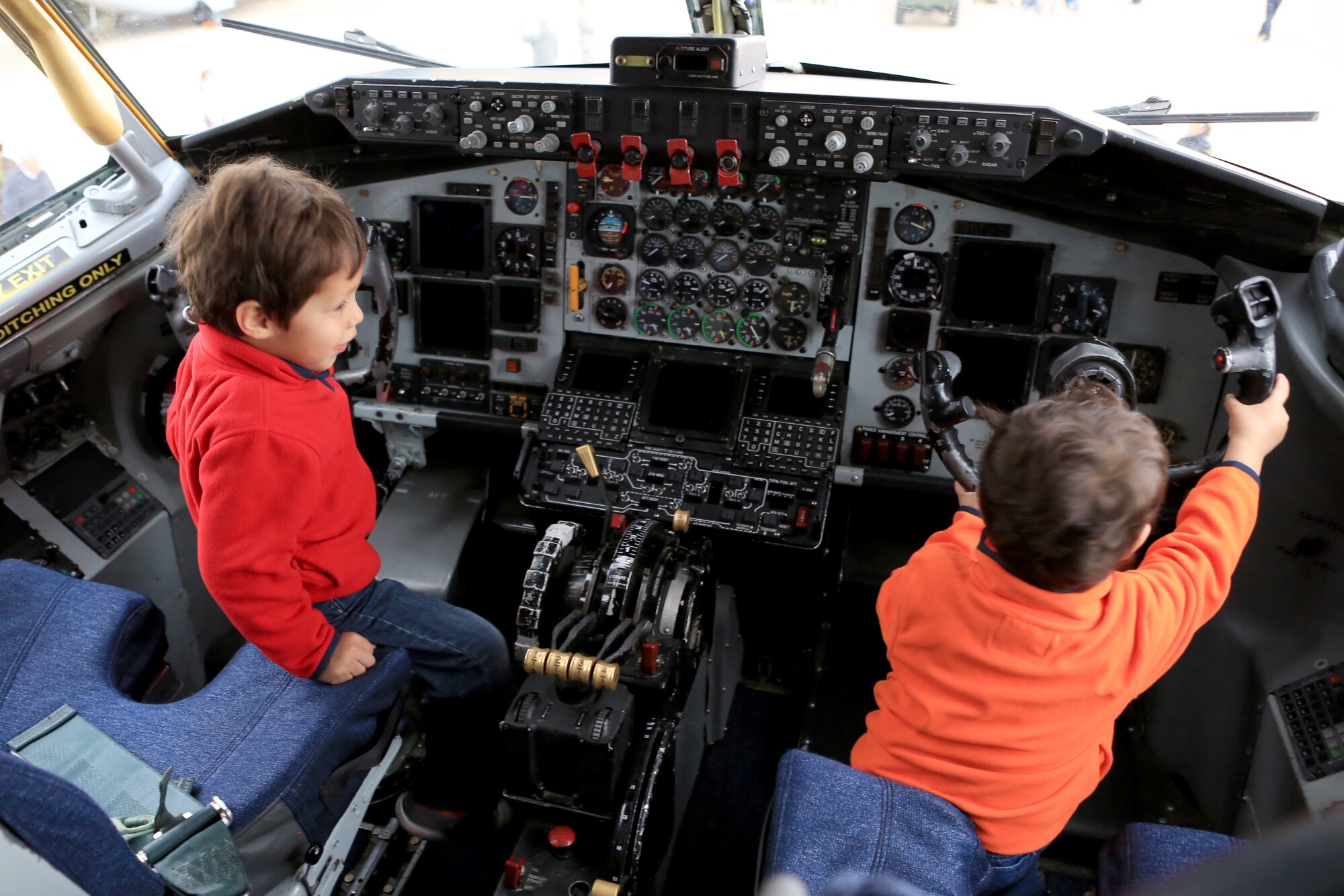 Children play in the pilot and copilot seats while viewing a static KC-135 Stratotanker aircraft assigned to the 351st Expeditionary Air Refueling Squadron Dec. 17, 2013, at Moron Air Base, Spain. The aircraft, from RAF Mildenhall, England, was part of a joint static display that included participants from the 351st EARS, the 496th Air Base Squadron, the Special-Purpose Marine Air-Ground Task Force Crisis Response and the Spanish Air Force. More than 400 U.S. and Spanish service members and their families at the base had the chance to view the static displays. (U.S. Marine Corps photo by Staff Sgt. Robert Fisher III/Released)