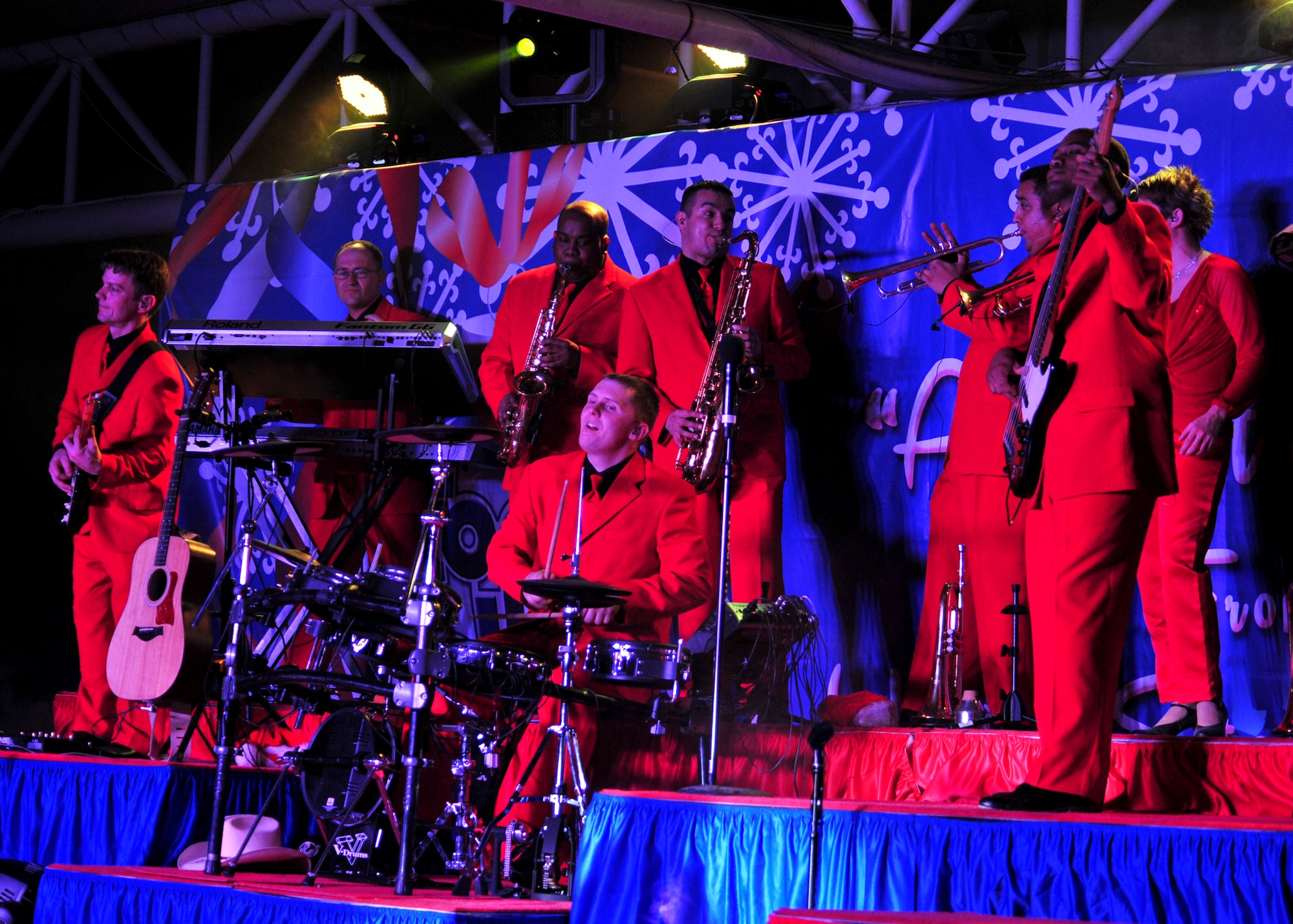 The Air Force Entertainment Group 'Gift of Music' band performs a show for the 380th Air Expeditionary Wing at an undisclosed location in Southwest Asia, Dec. 19, 2013. (U.S. Air Force photo by Staff Sgt. Michael Means/Released)
