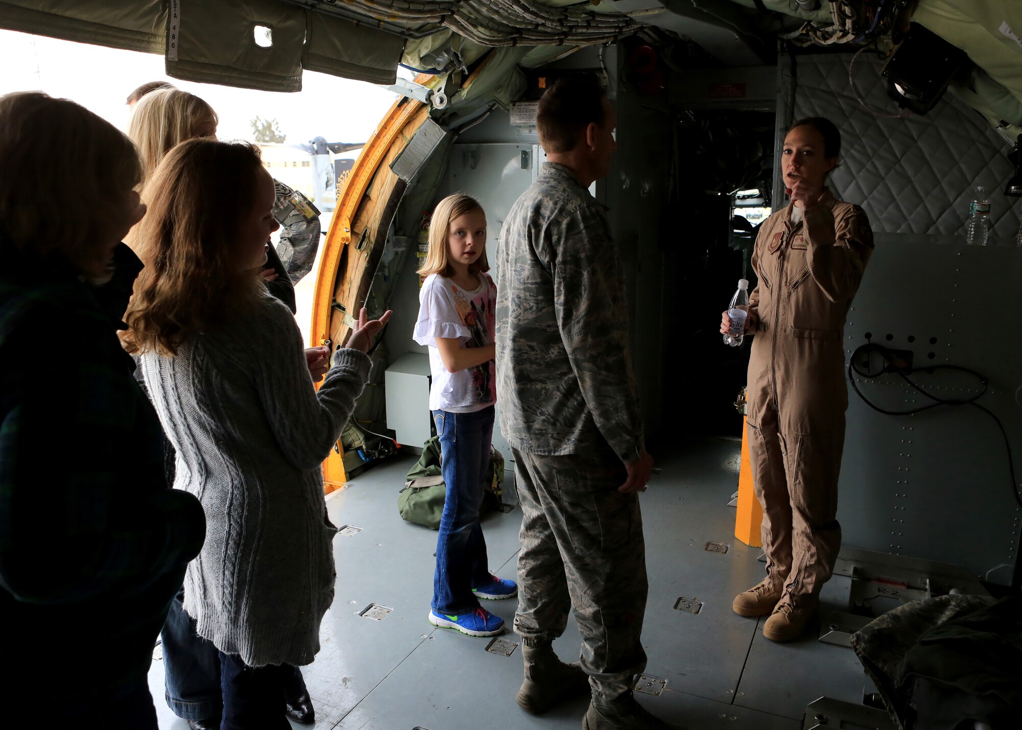 U.S. Air Force Capt. Catherine Nelson, 351st Expeditionary Air Refueling Squadron pilot from College Station, Texas, speaks with local children and a member of the 496th Air Base Squadron inside a static KC-135 Stratotanker aircraft Dec. 17, 2013, at Moron Air Base, Spain. The aircraft, from RAF Mildenhall, was part of a joint static display which included participants from the 351st EARS, the 496th ABS, the Special-Purpose Marine Air-Ground Task Force Crisis Response and the Spanish Air Force. The static display was held for U.S. and Spanish service members and their families at the base. (U.S. Marine Corps photo by Staff Sgt. Robert Fisher III/Released)
