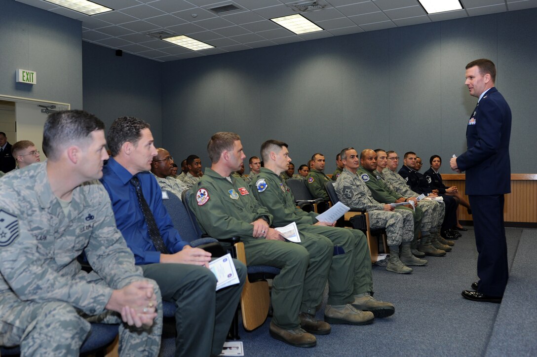 U.S. Air Force Lt. Col. Robert Pekarek, 18th Operations Support Squadron commander, gives closing remarks during a rededication ceremony on Kadena Air Base, Japan, Dec. 20, 2013. The building was dedicated in honor of Cardin in 1983 after he perished in a mid-air collision during a training exercise. The building was dedicated in his memory to honor the sacrifices made by those fighting for freedom in both peace and war time. (U.S. Air Force photo by Airman 1st Class Hailey R. Staker)

