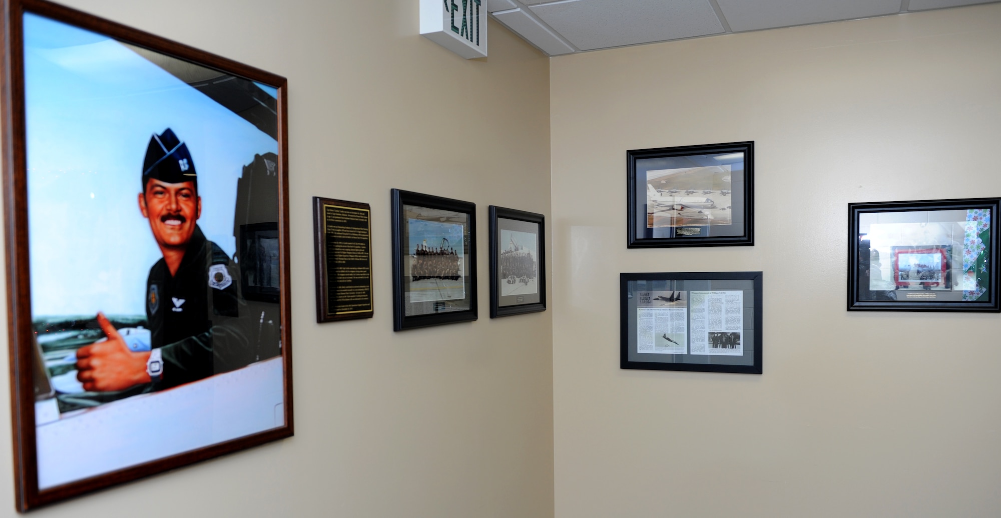 Memorabilia of Capt. Edwin Cardin, 67th Fighter Squadron F-15 Eagle pilot, are displayed on the walls of the 18th Operations Support Squadron building on Kadena Air Base, Japan, Dec. 20, 2013. The 18th OSS rededicated the building Dec. 20 as a remembrance and renewed commitment to honor the sacrifices of Capt. Edwin Cardin, who perished during a mid-air collision in 1982. (U.S. Air Force photo by Airman 1st Class Hailey R. Staker)
