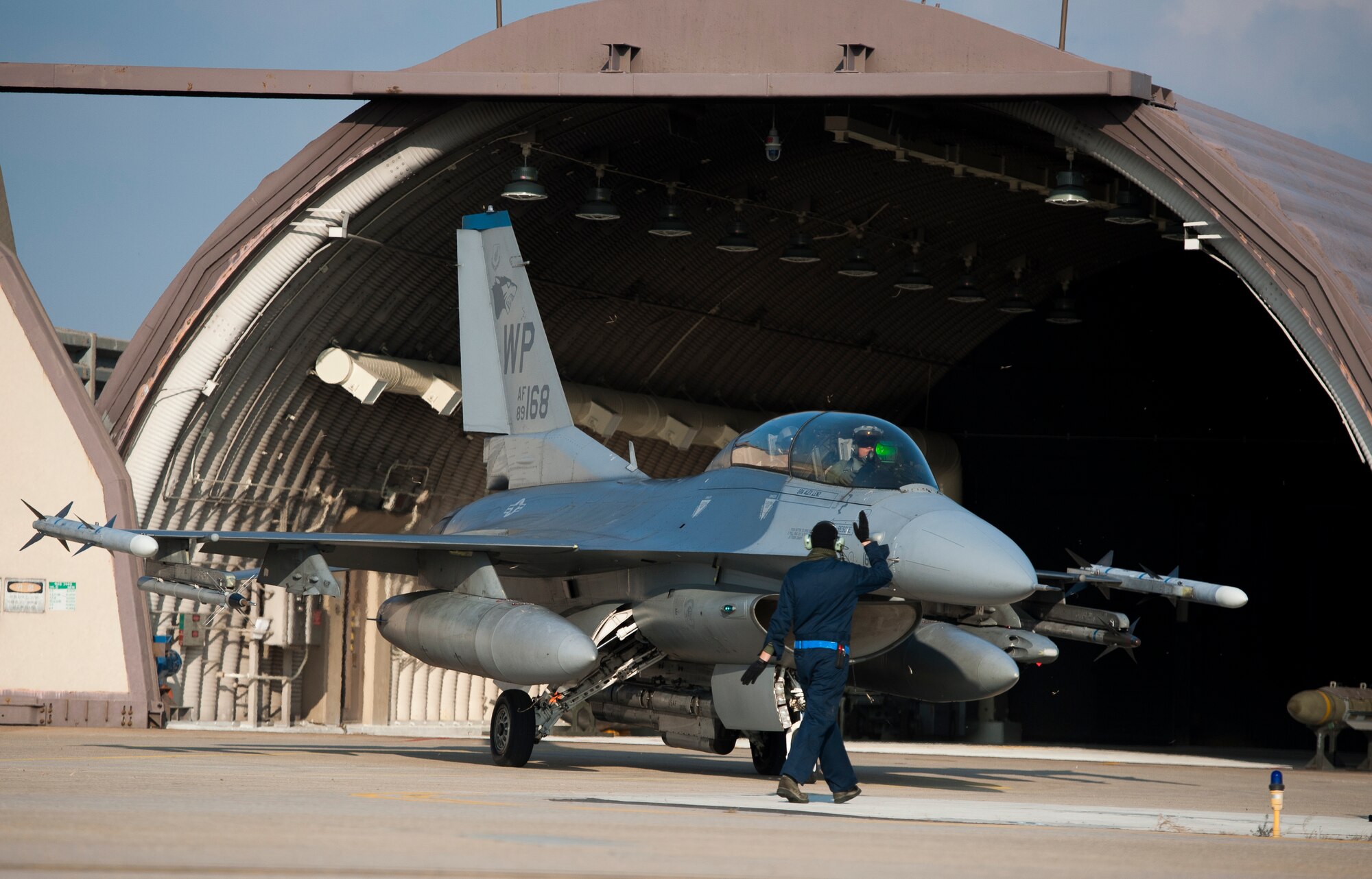 Lt. Col. Erik Bruce, 8th Security Forces Squadron commander,  and Lt. Col. Matthew Higgins, 35th Fighter Squadron commander, taxi into a parking spot after a familiarization flight at Kunsan Air Base, Republic of Korea, Dec. 18, 2013. Familiarization flights let personnel other than aircrew experience the Air Force’s flying mission first-hand, giving them a better perspective on aerial operations and how their job impacts the flying mission. (U.S. Air Force photo by Senior Airman Armando A. Schwier-Morales)